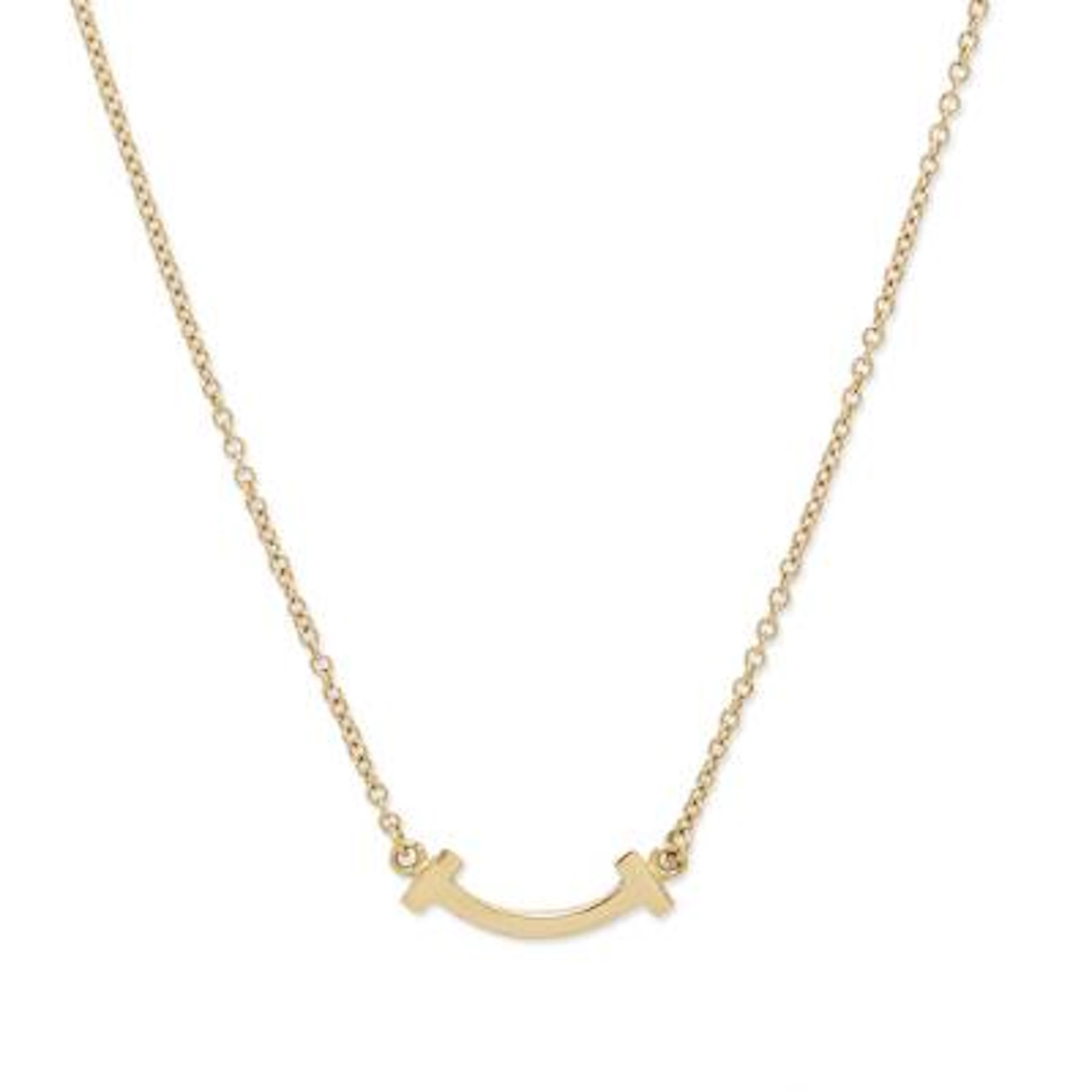 Tiffany & Co.: A "T Smile" necklace of 18k gold. Weight app. 2.3 g.