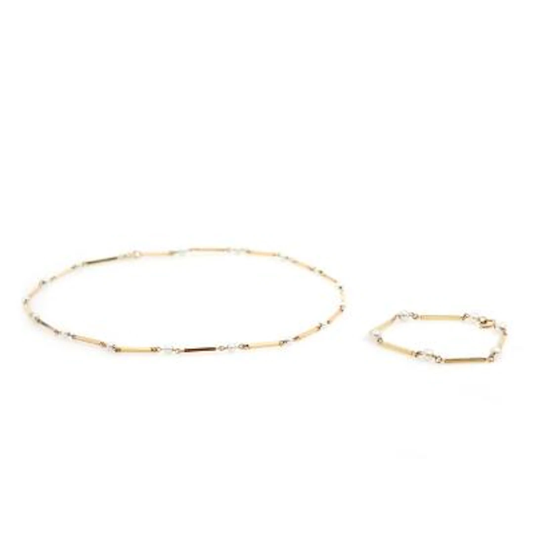 A pearl bracelet and necklace set with numerous cultured pearls, mounted
