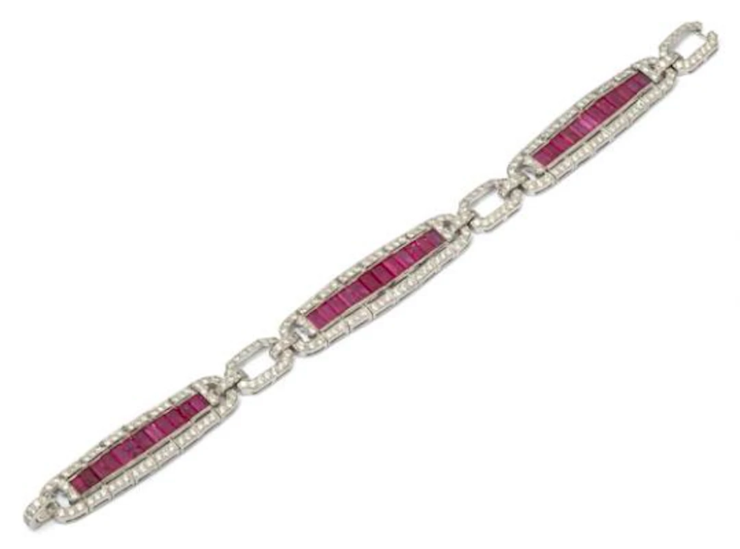 A ruby and diamond bracelet set with numerous rubies and diamonds