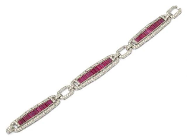 A ruby and diamond bracelet set with numerous rubies and diamonds