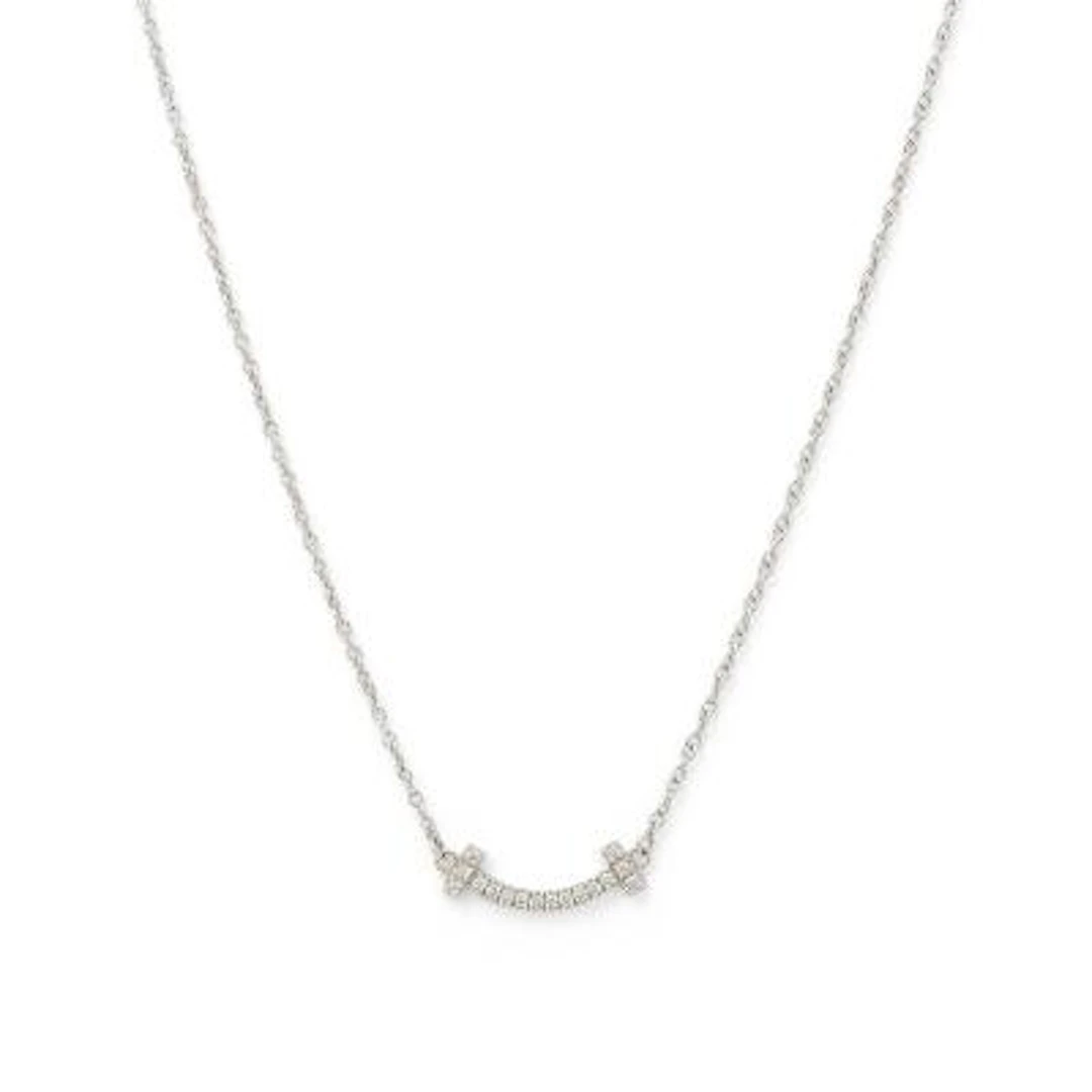 Tiffany & Co.: A "T Smile" necklace set with a diamond pendant, mounted