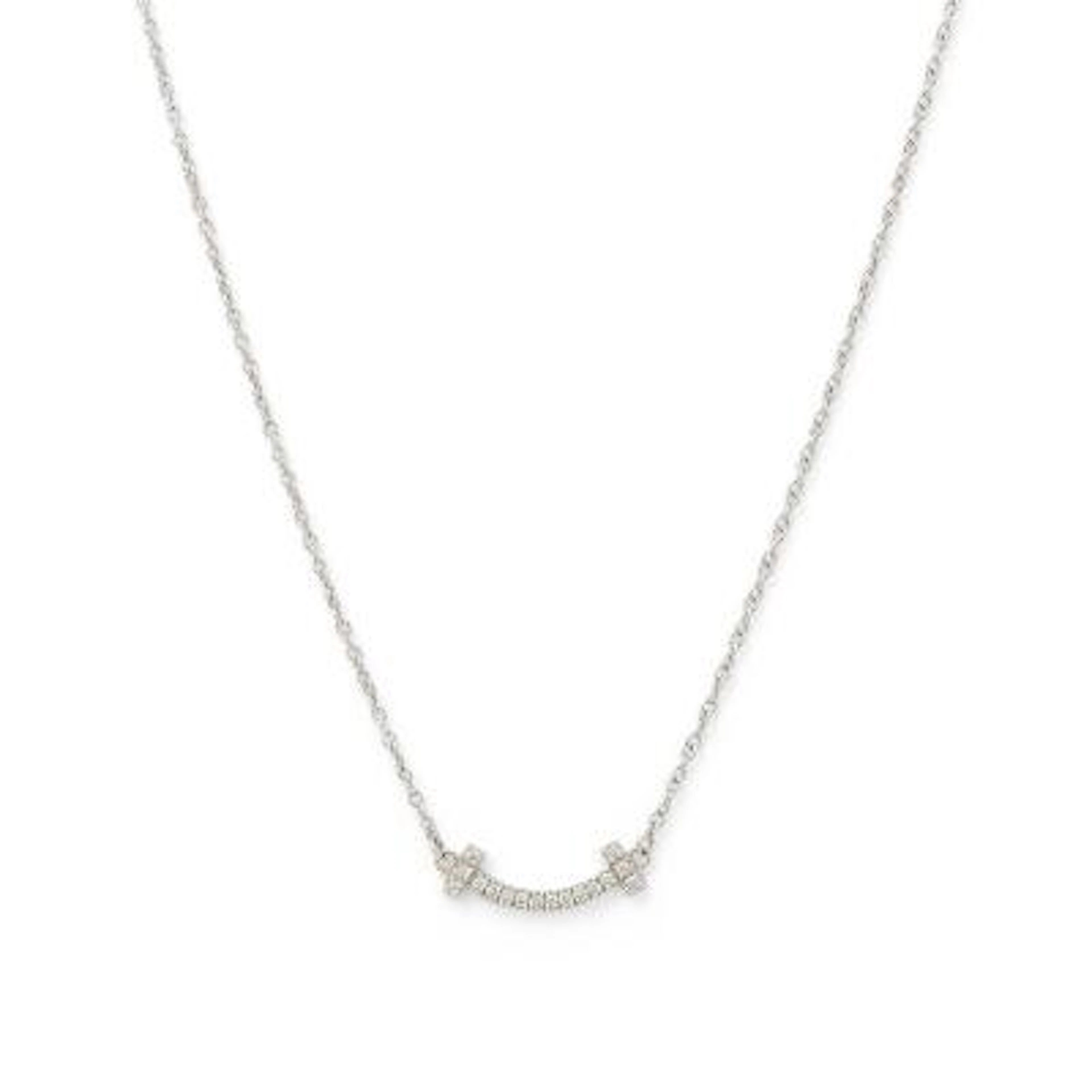 Tiffany & Co.: A "T Smile" necklace set with a diamond pendant, mounted