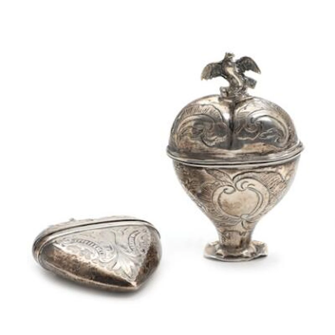 Two silver heart-shaped vinaigrettes. 19th–20th century. H. 6.5–8