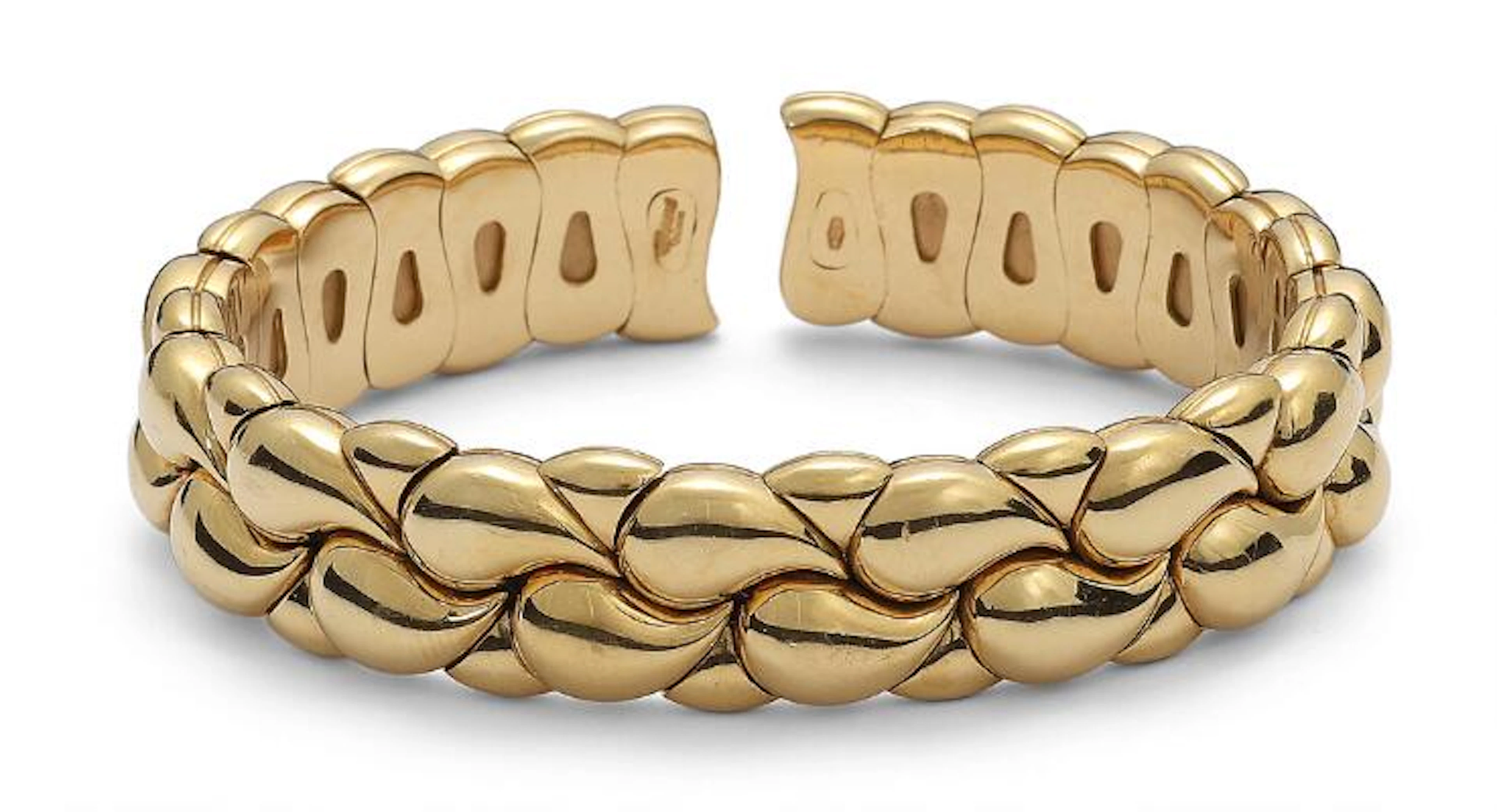 Chopard: A "Casmir" flexible bangle of 18k gold. Weight app. 80 g.