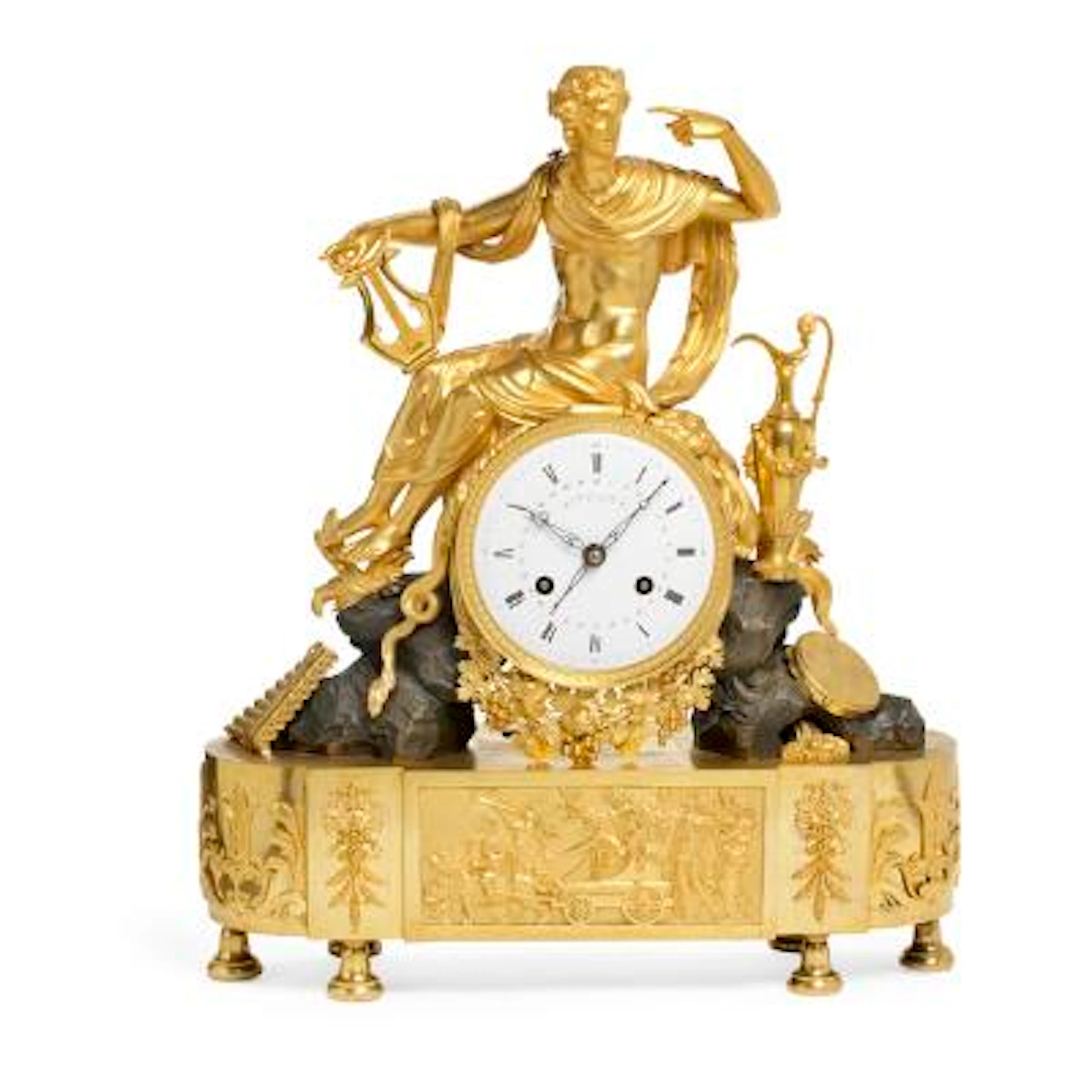 A French Empire gilt and patinated bronze figural mantel clock. The
