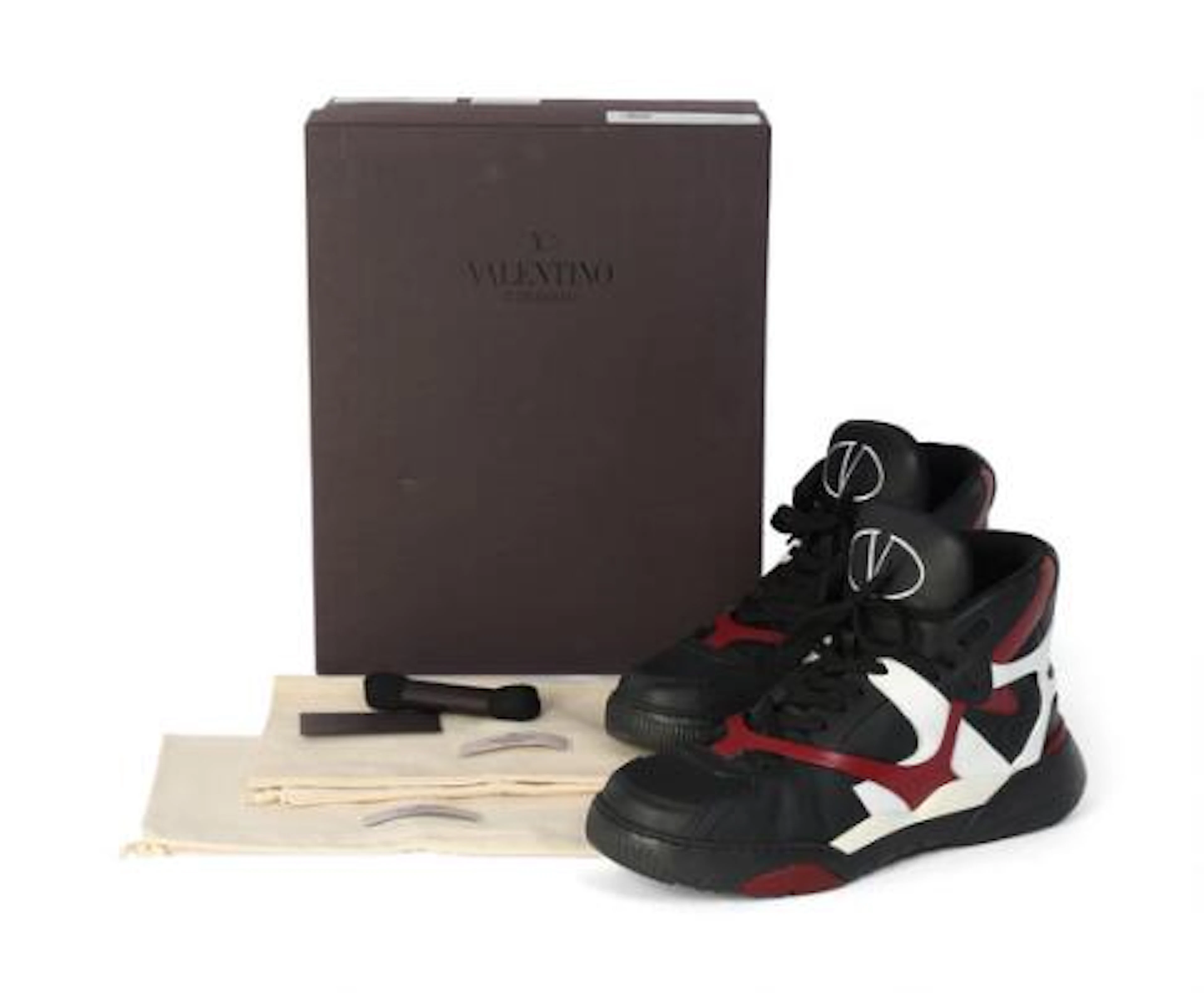 Valentino: A pair of mens high-top sneakers of white, black and burgundy
