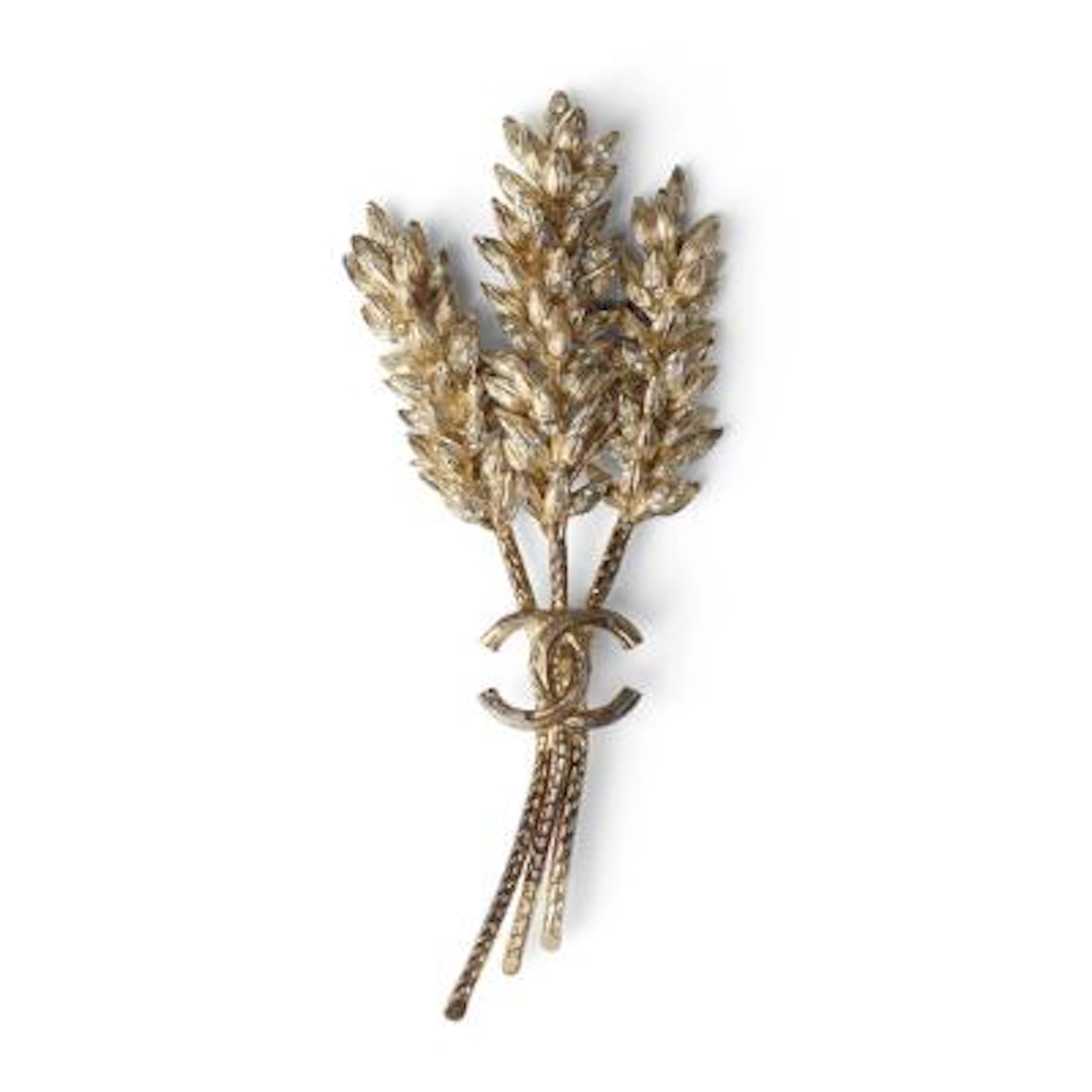 Chanel: A brooch set with numerous white stones, mounted in gilded
