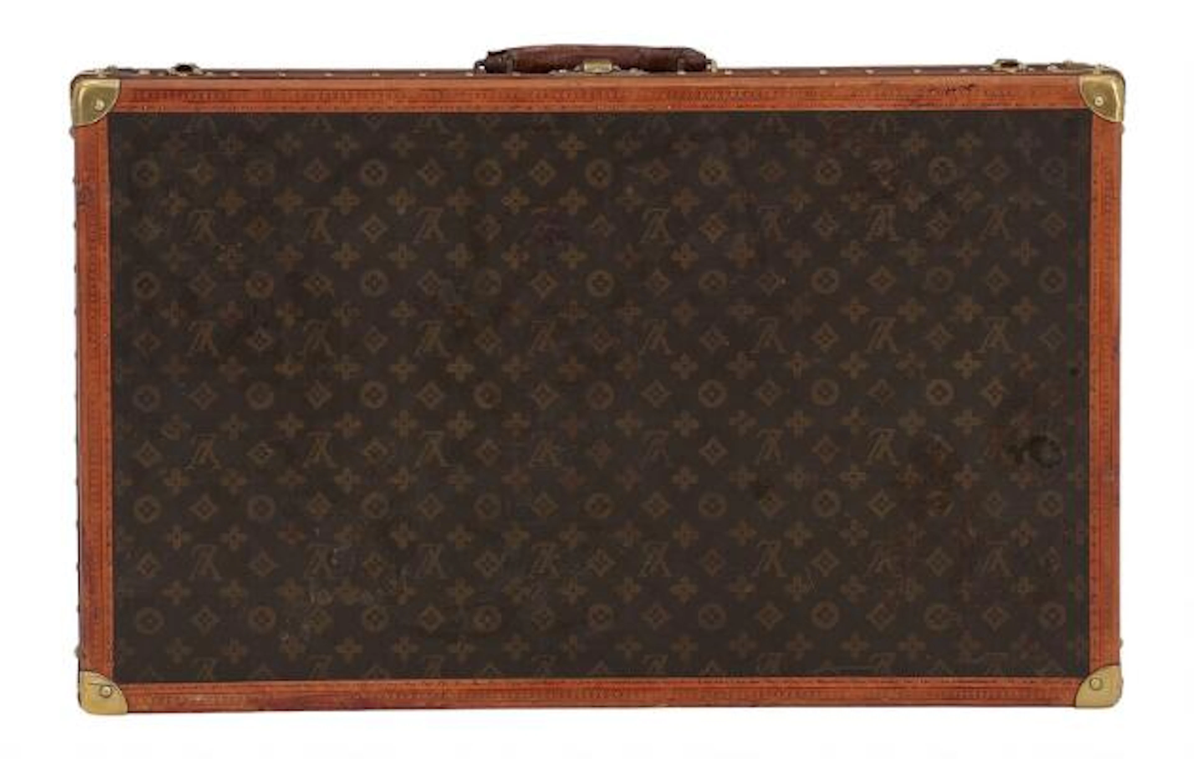 Louis Vuitton: Trunk af brunt monogram kanvas med brune læderbesætninger