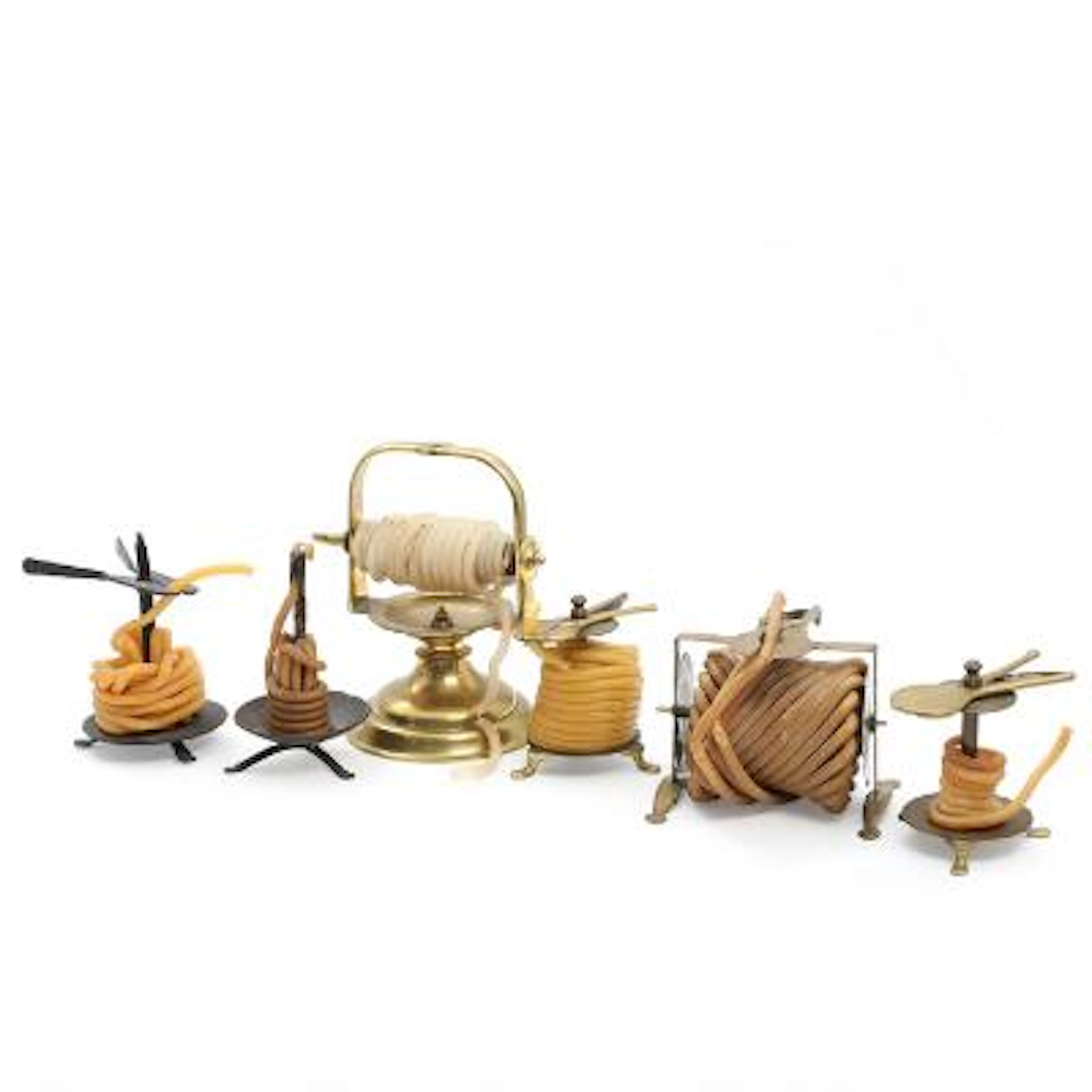 A selection of brass or iron wax jacks. 19th-20th century. H. 12-21.5