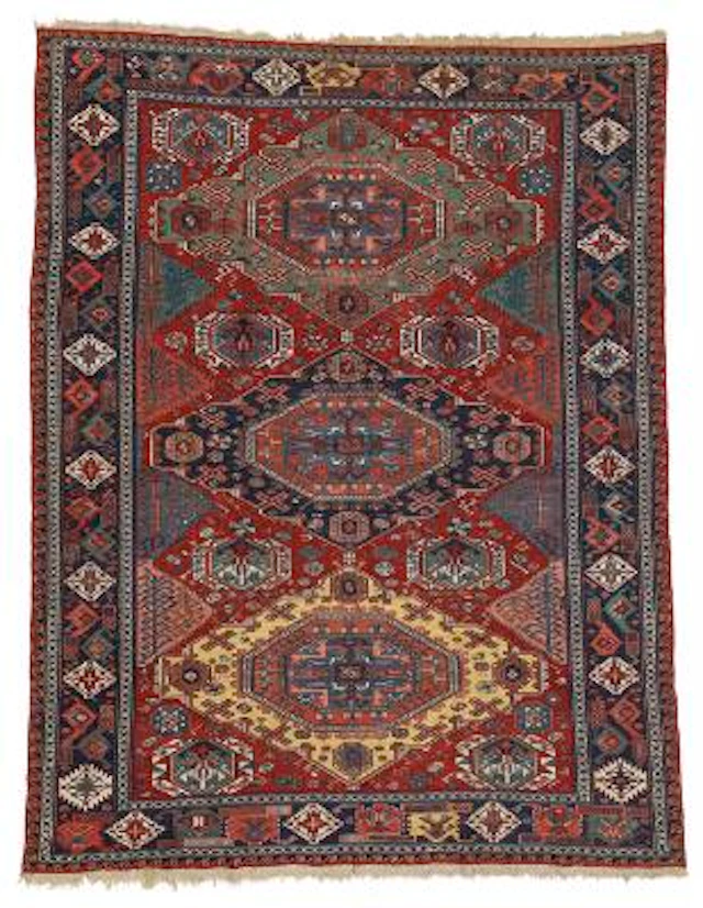 An antique Caucasian sumac carpet. Design with three stylized medallions.