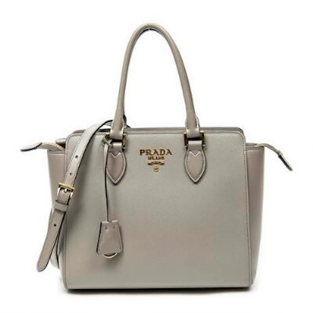 Prada: A bag of grey leather with gold-tone hardware, two handles