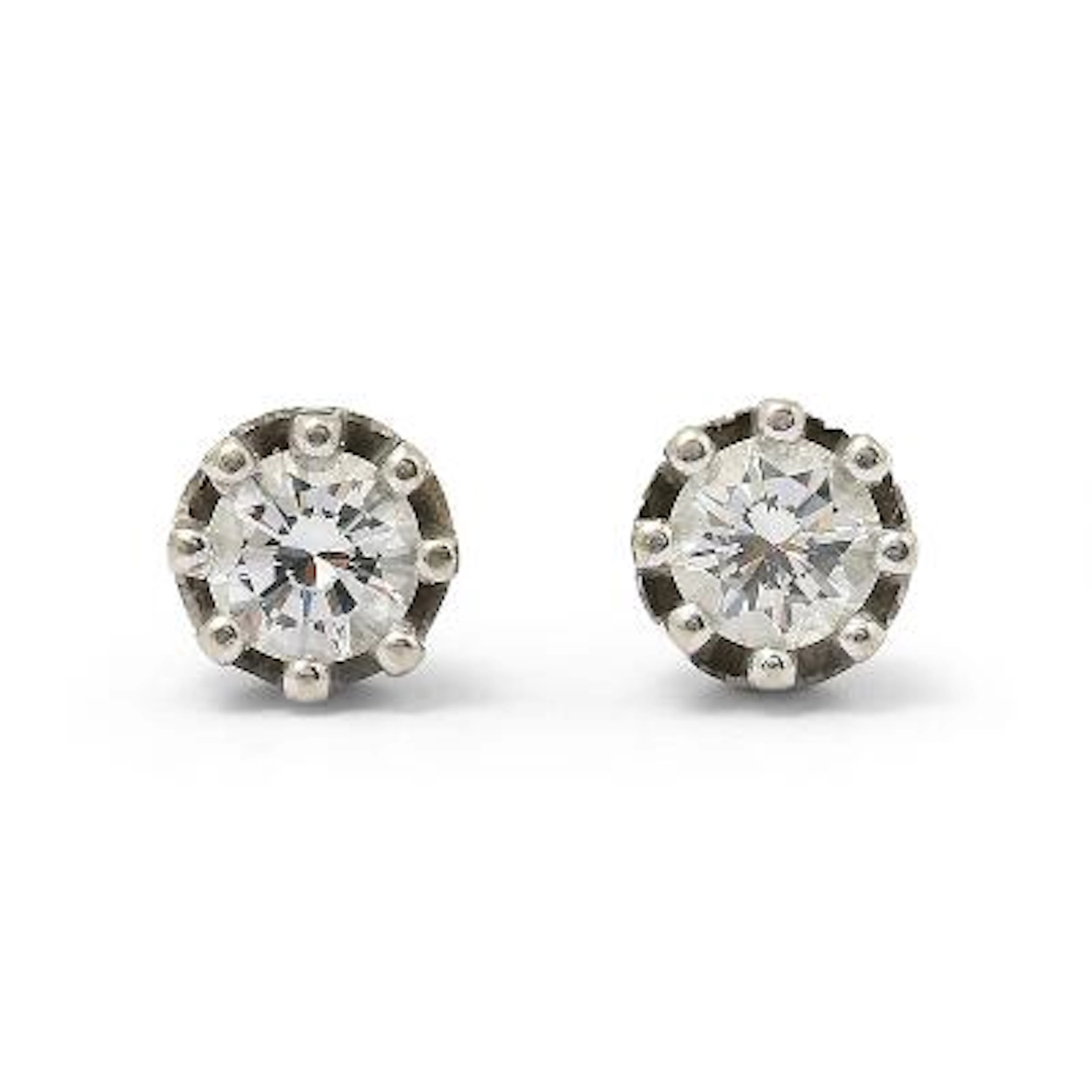 A pair of solitaire diamond ear studs each set with a brilliant-cut