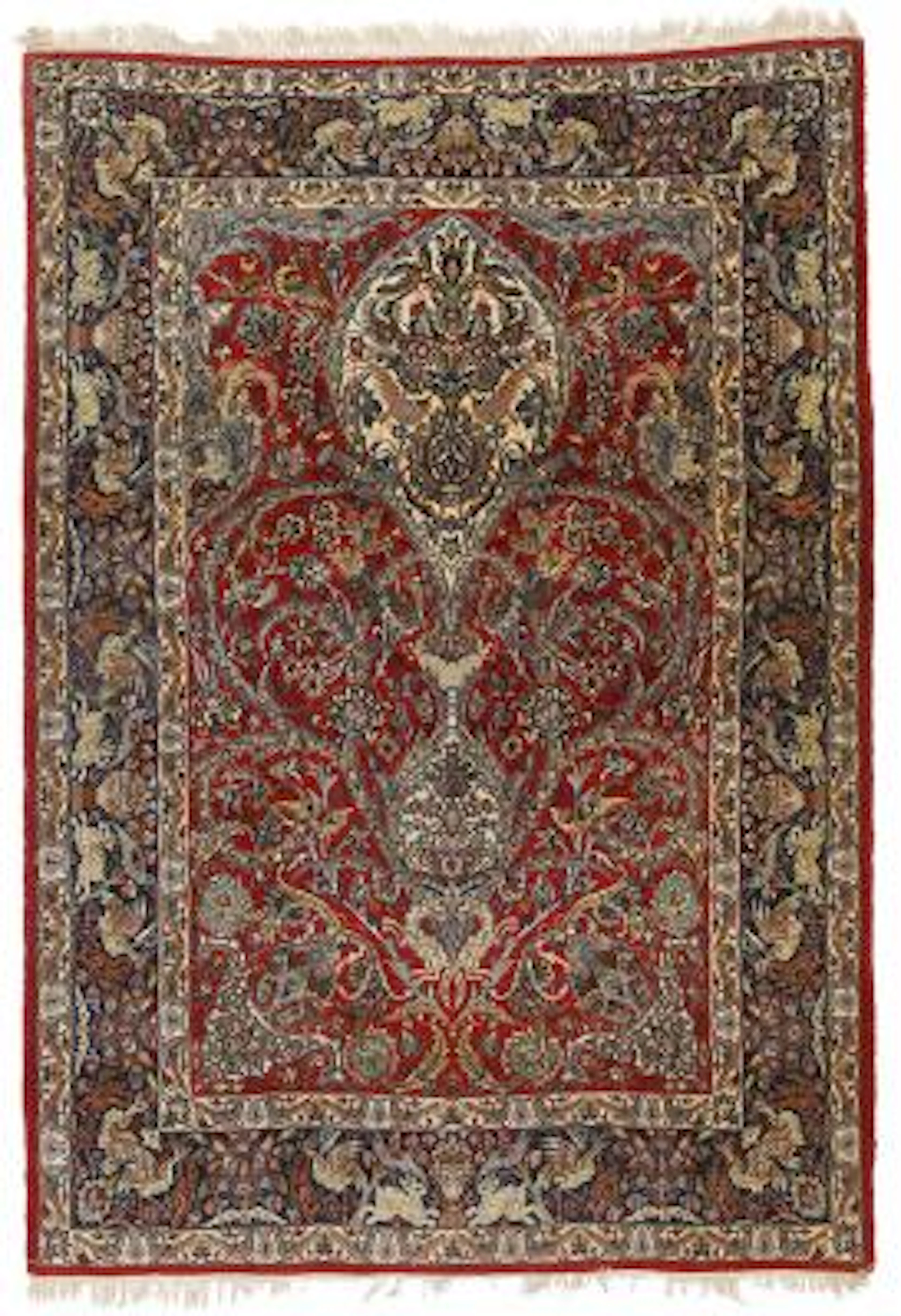 An Isfahan rug, Persian. Entwined branches on a red field. Late 20th