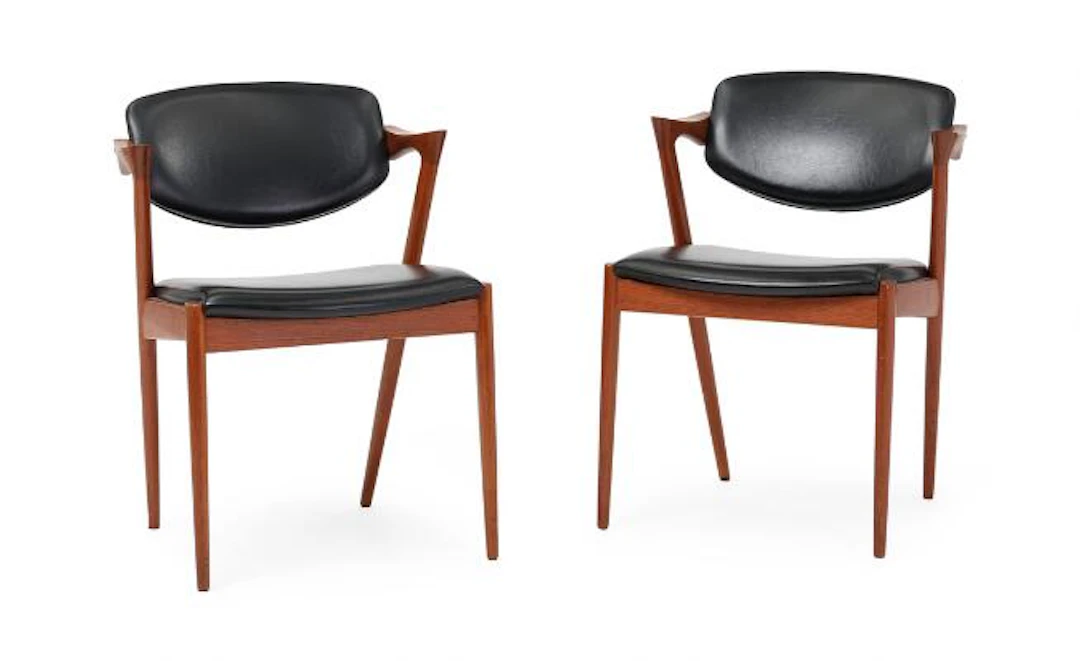 Kai Kristiansen: A pair of teak armchairs. Seat and tilt back upholstered