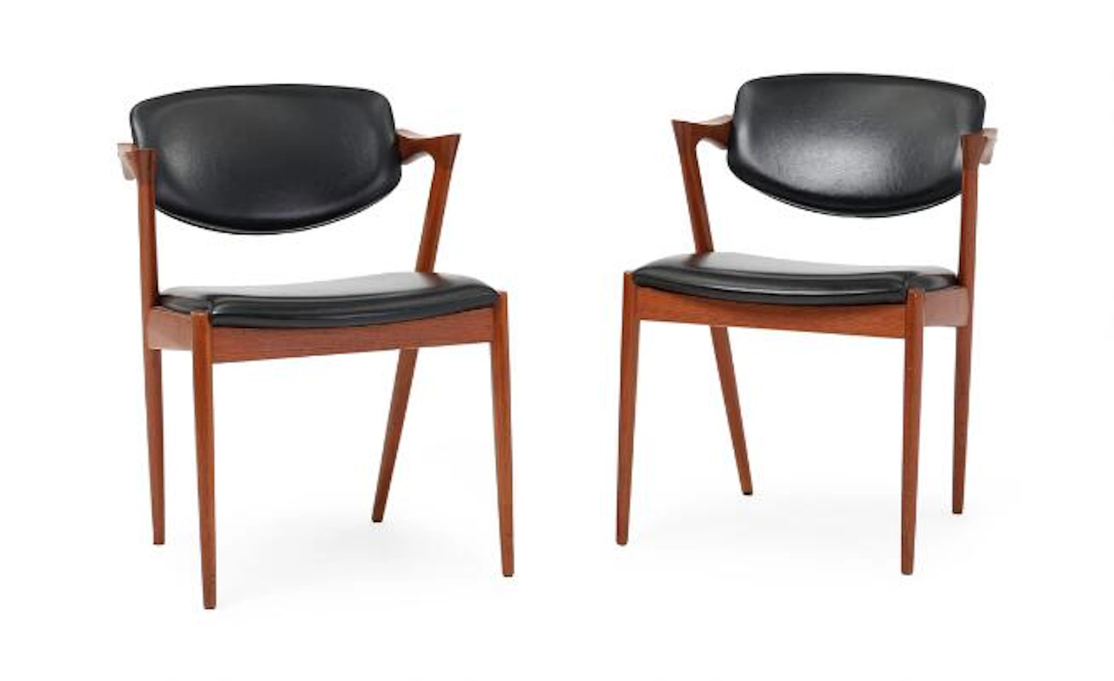Kai Kristiansen: A pair of teak armchairs. Seat and tilt back upholstered