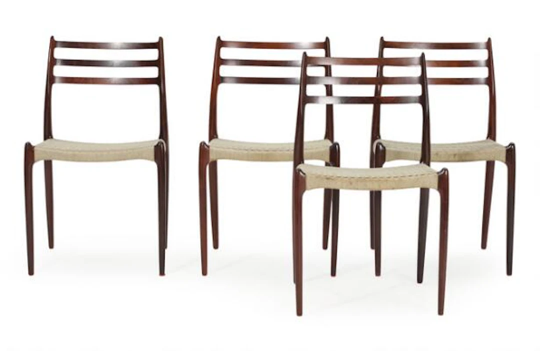 Niels O. Møller: Four rosewood chairs, seats woven with blue cord.