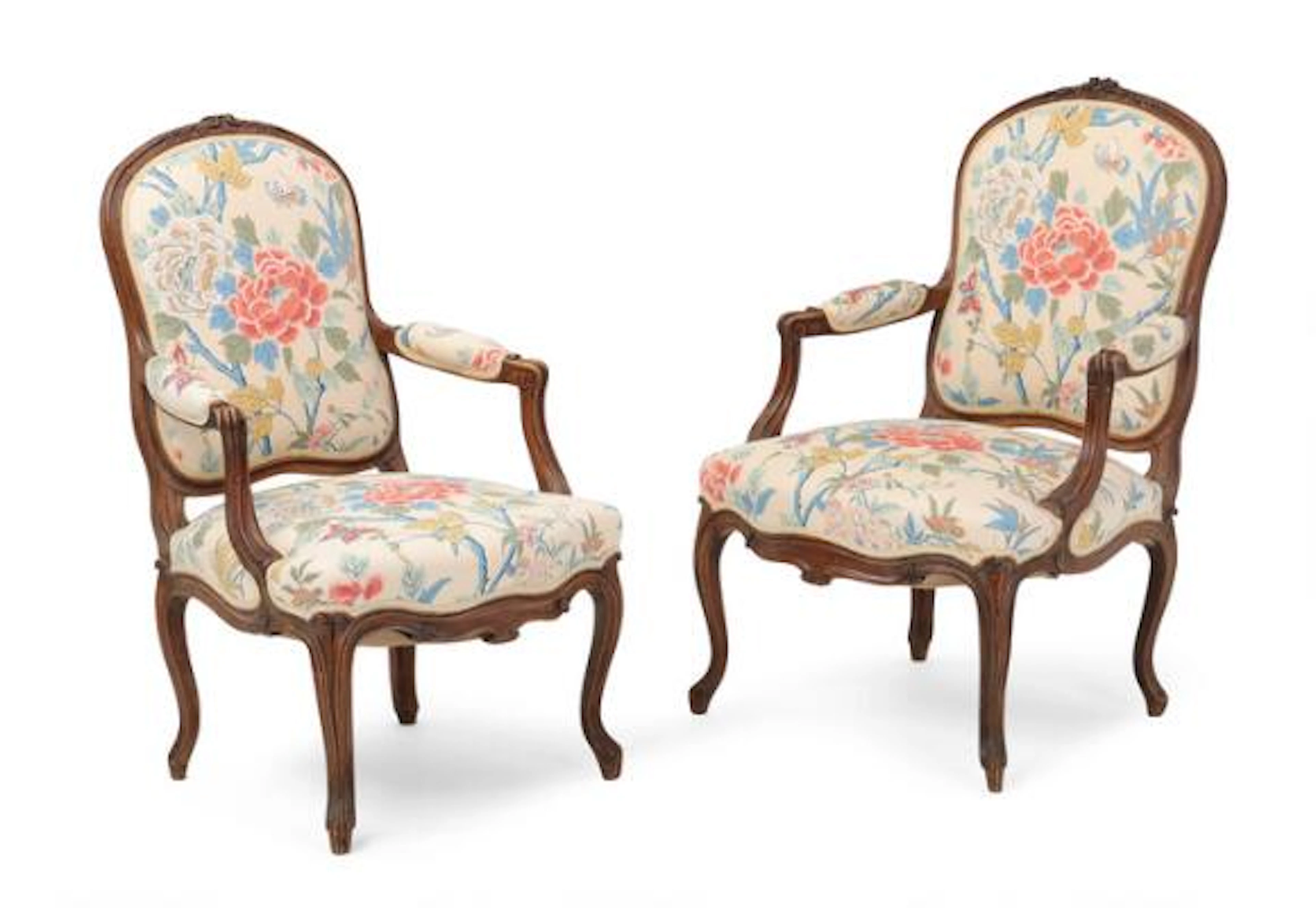 A pair of armchairs in dark polished wood. Rococo style, 20th century