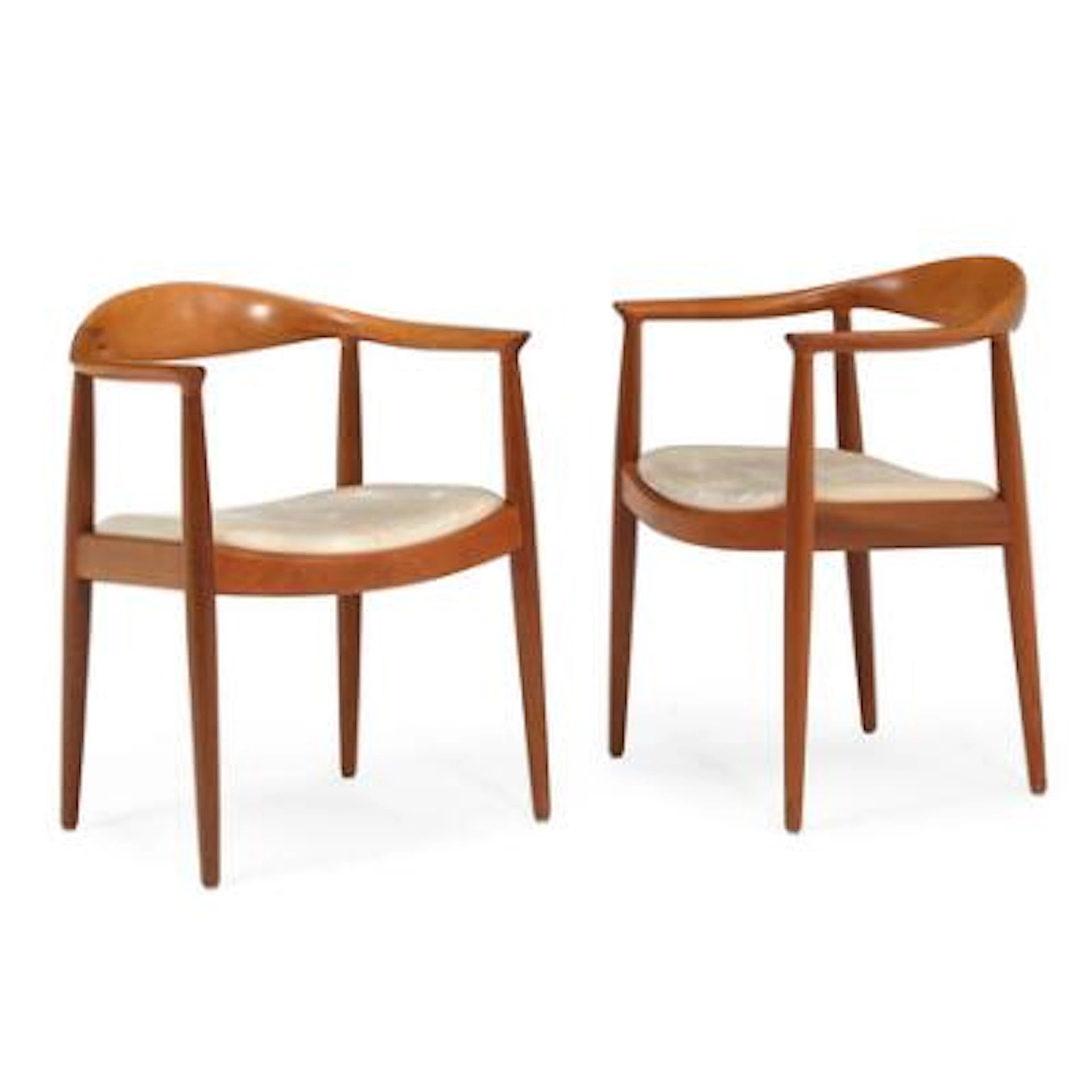 Hans J. Wegner: “The Chair”. A pair of mahogany armchairs. Seat upholstered