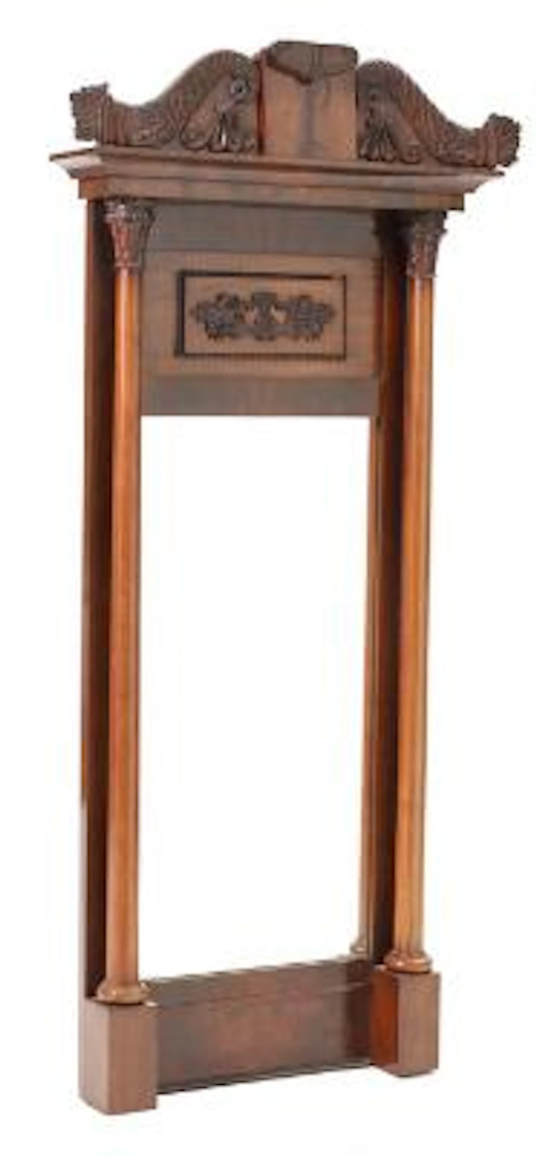 A late Empire mahogany mirror, flanked by columns. 19th century. H.