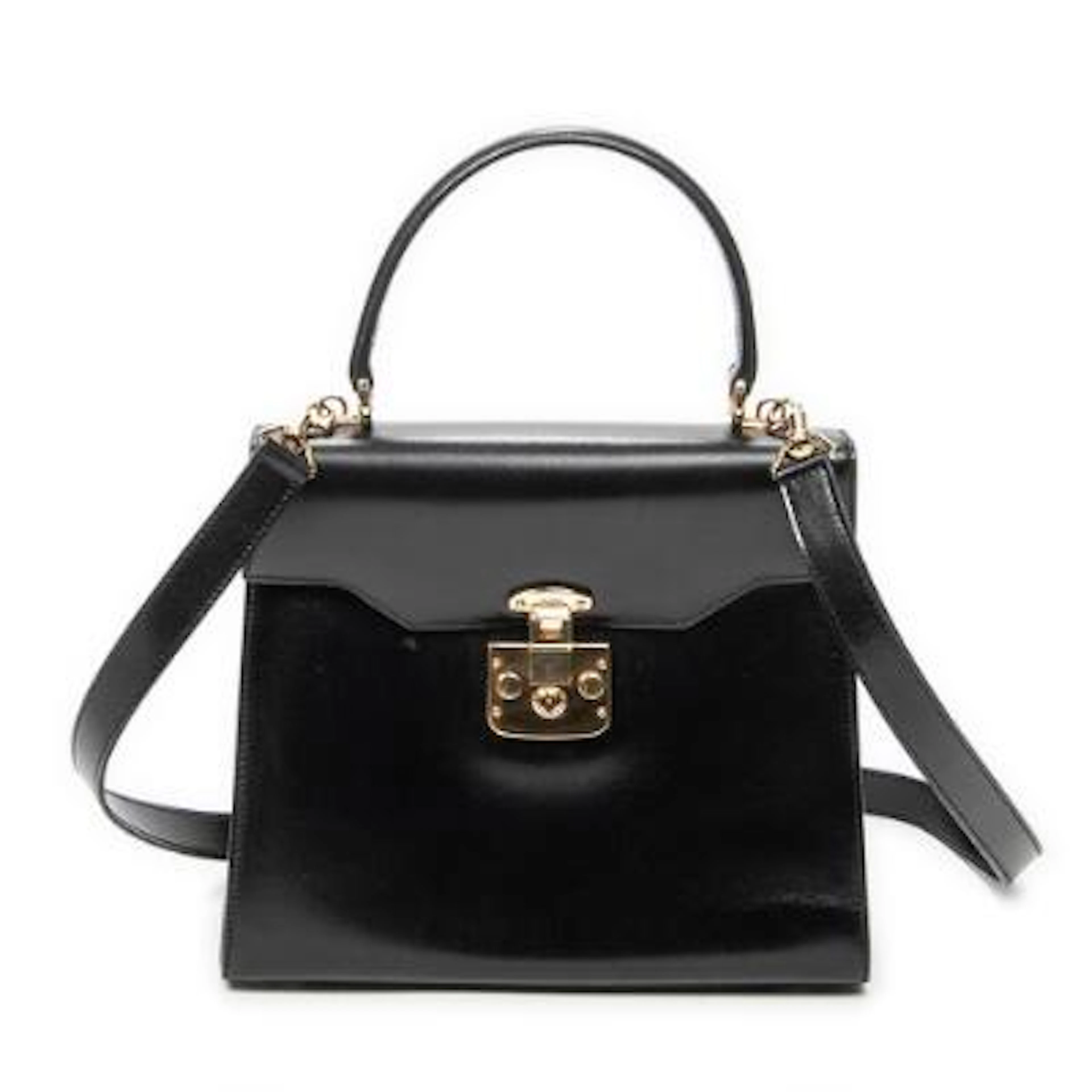 Gucci: A "Vintage Flap Top Handle" bag in black leather with gold-tone