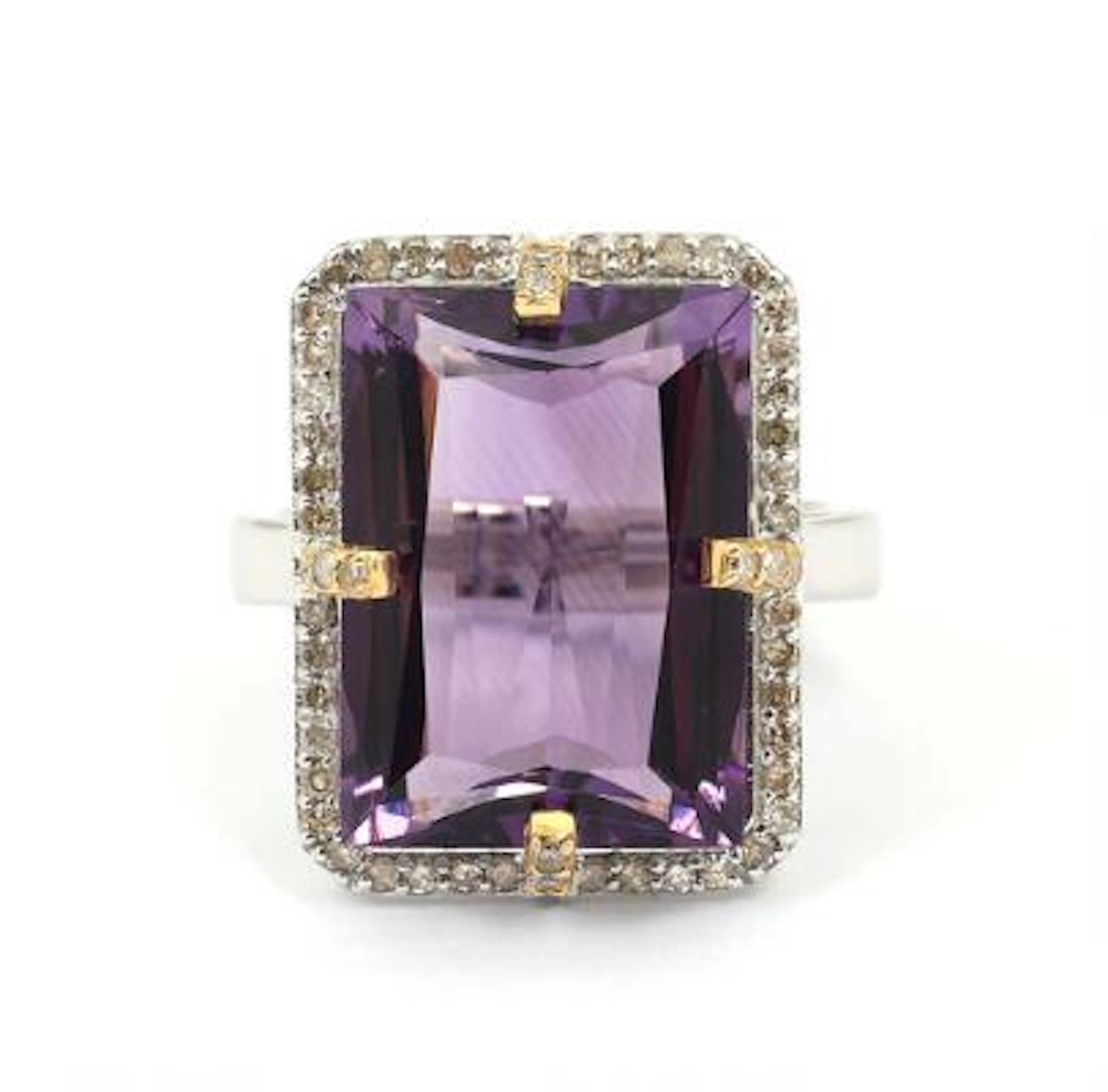 A topaz ring set with a faceted topaz and numerous diamonds, mounted