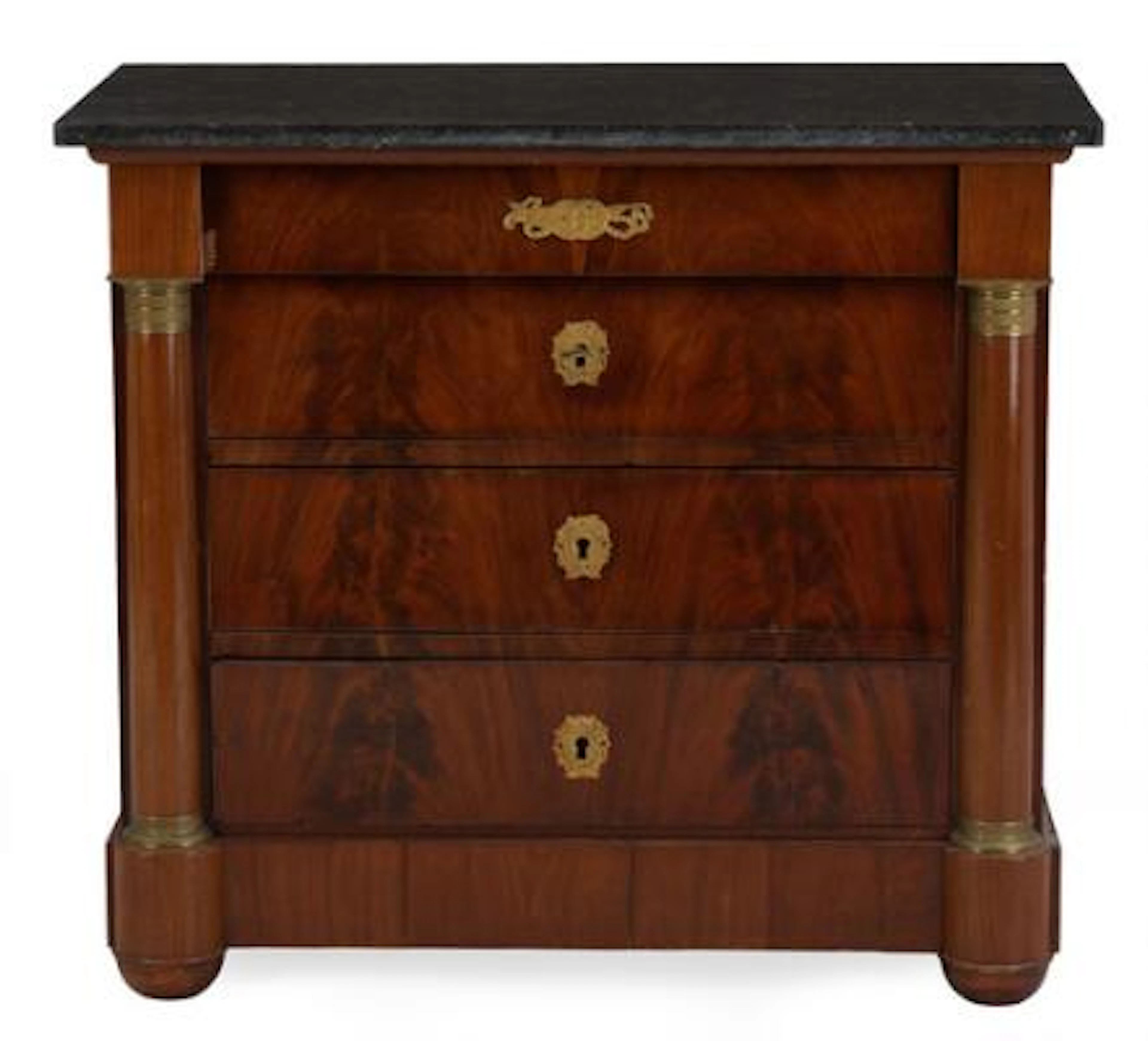 A French mahogany commode with gilt bronze fittings and black granite
