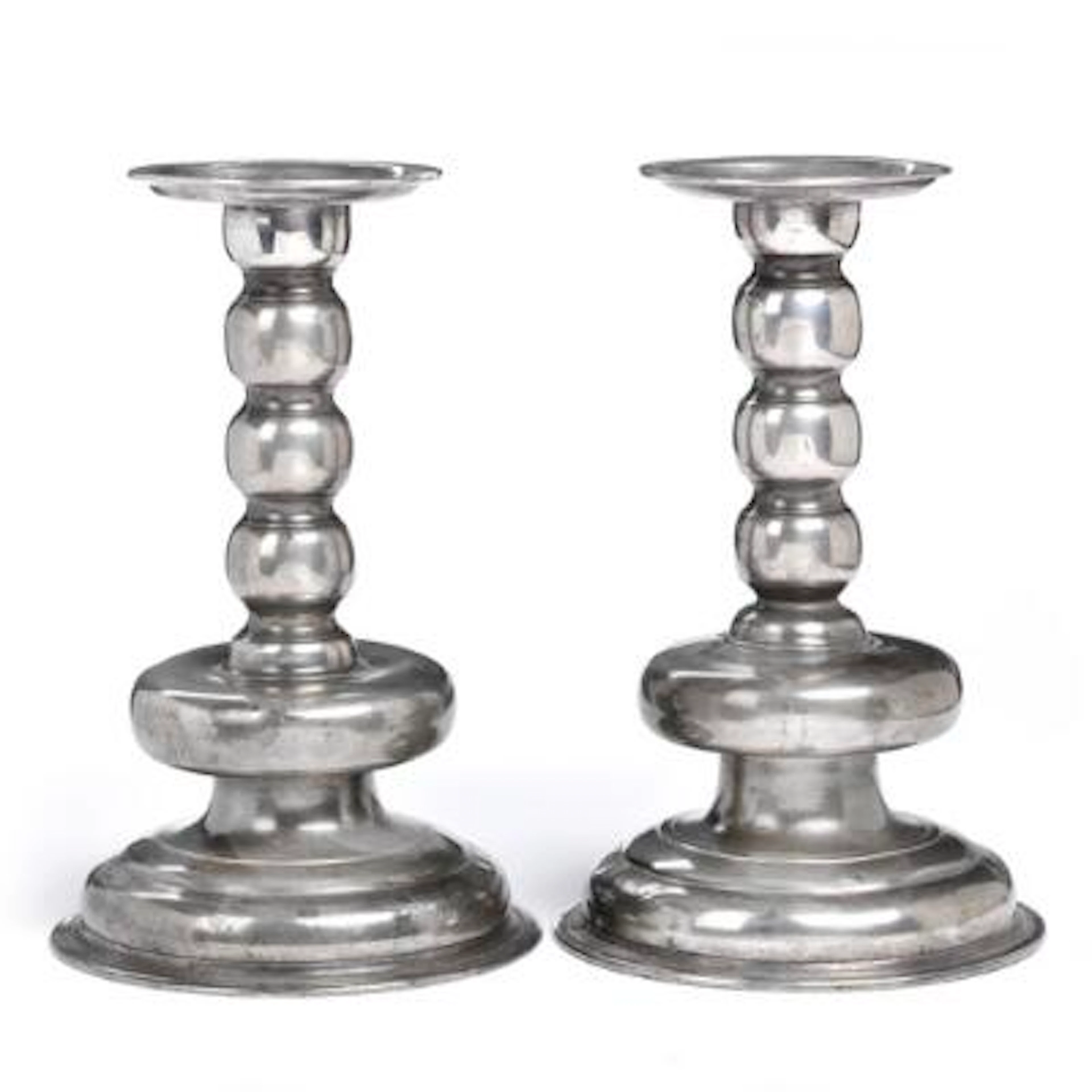 A pair of North German Baroque candlesticks of tin, 18th century.