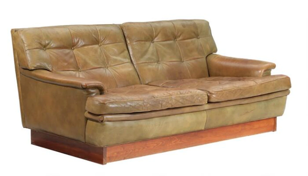Arne Norell: “Mexico”. Two seater sofa with beech plinth. Seat, sides