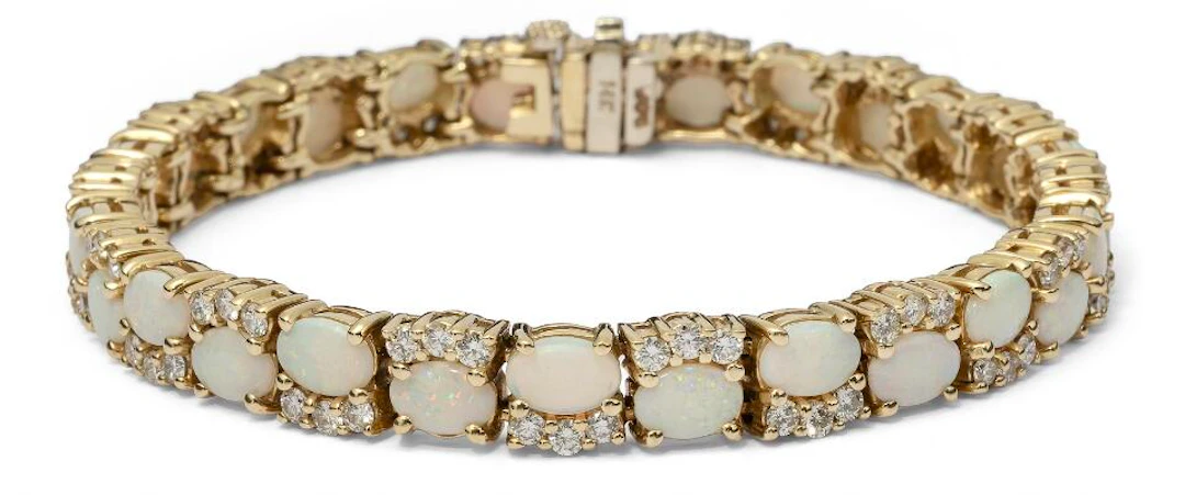 An opal and diamond bracelet set with numerous opals and diamonds