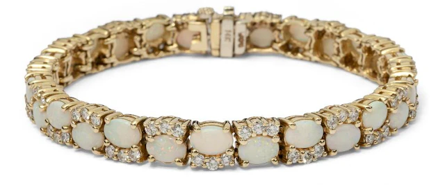 An opal and diamond bracelet set with numerous opals and diamonds