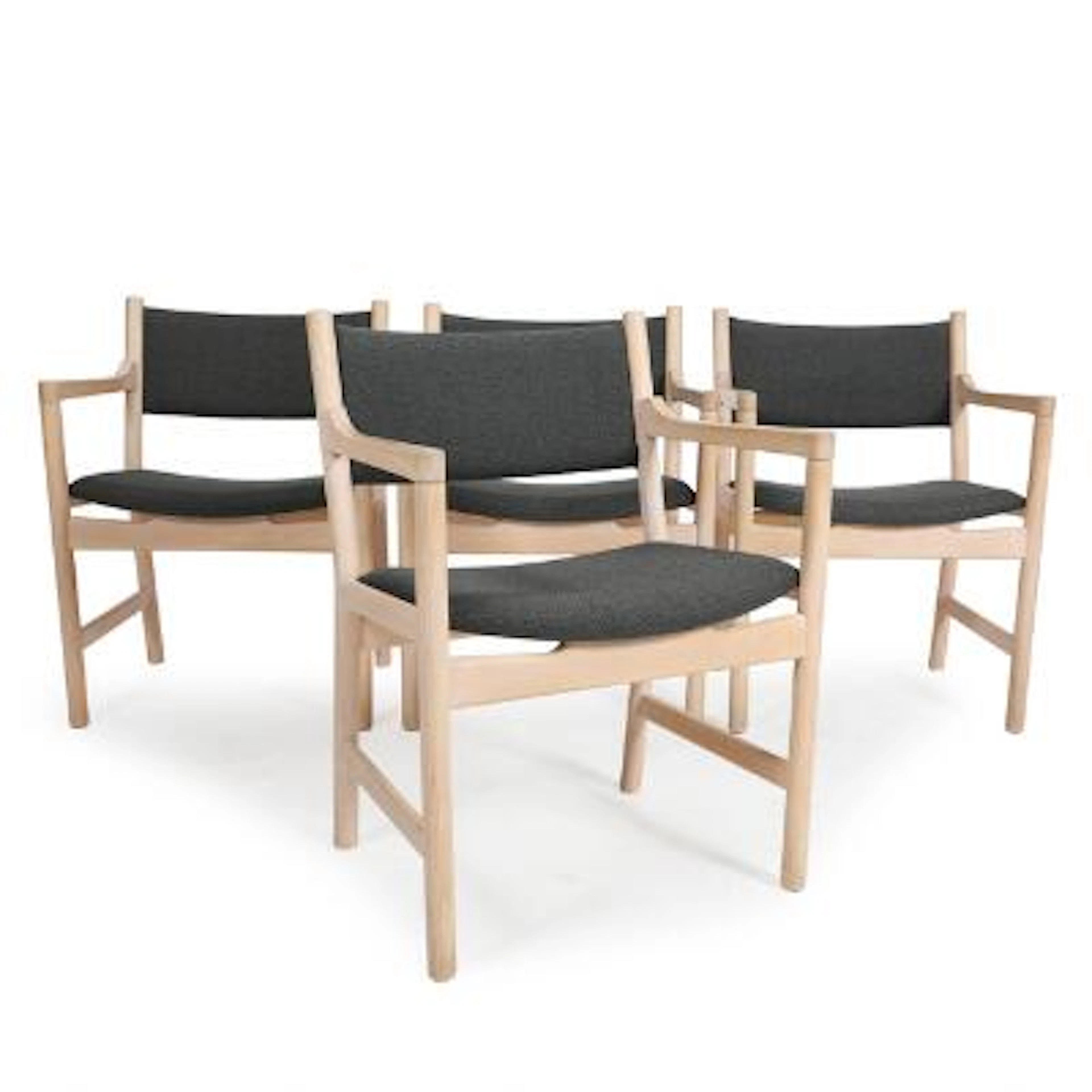 Hans J. Wegner: “CH 50”. Set of four armchairs with beech frame. Upholstered