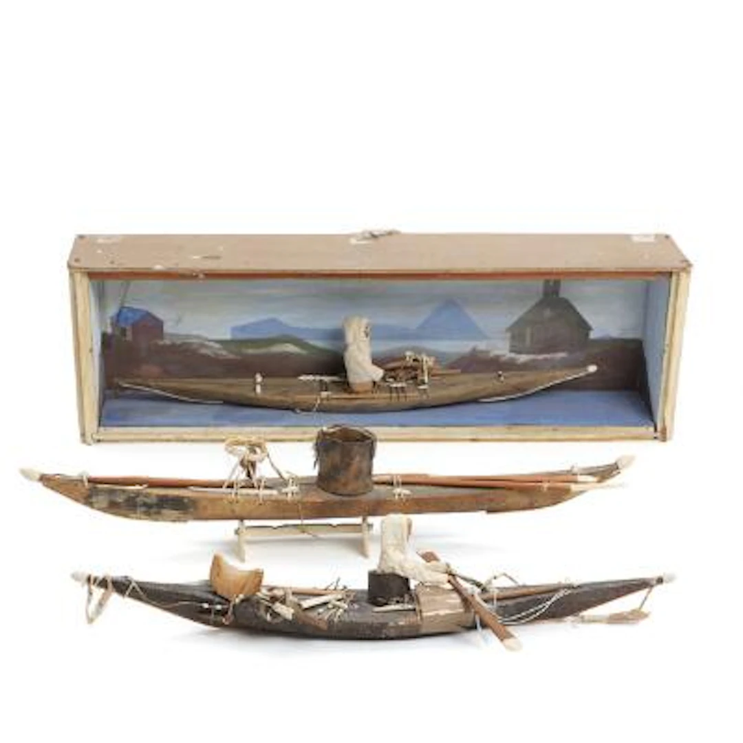 Three models of Greenlandic kayaks of hide, wood and bone. 20th century.