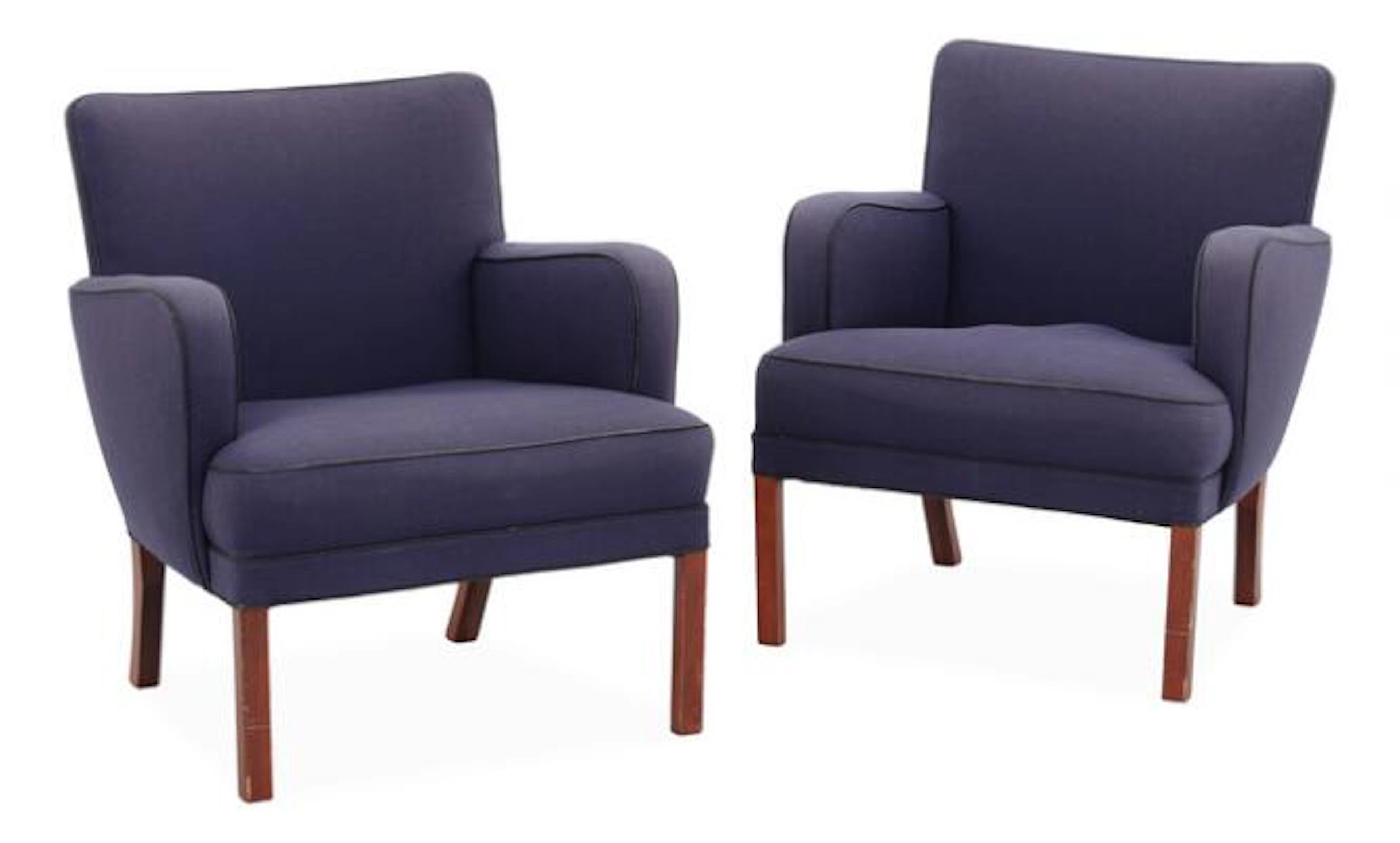 Kaare Klint: A pair of easy chairs with stained beech legs, upholstered