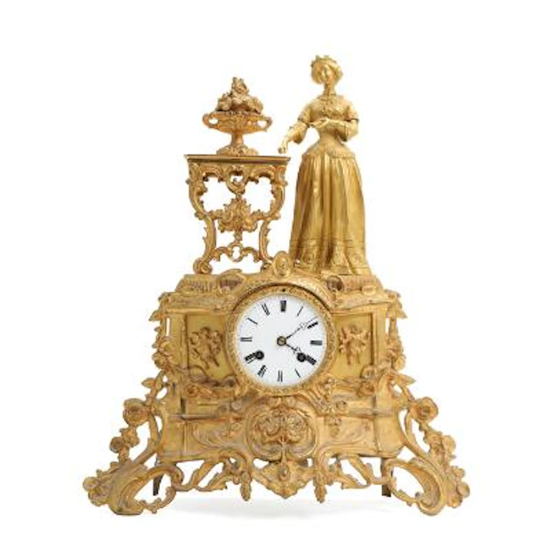 French gilt metal mantel clock, surmounted by a noblewoman. G.F. Petit