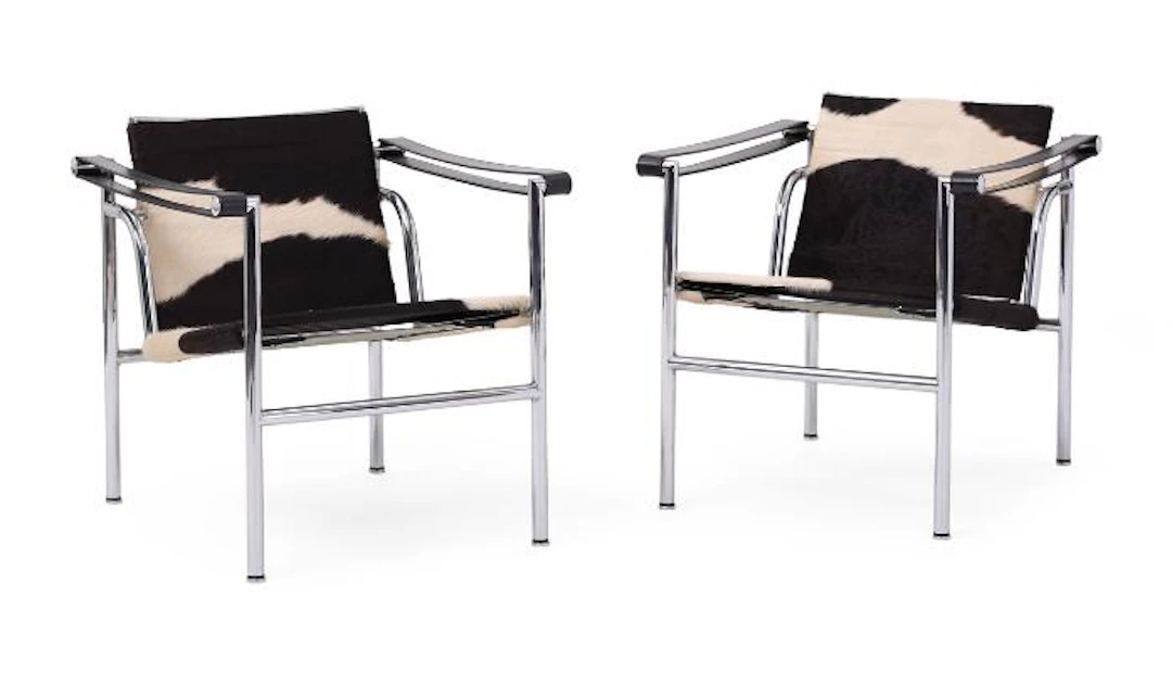Le Corbusier: “LC1”. A pair of armchairs with chromed steel frame.