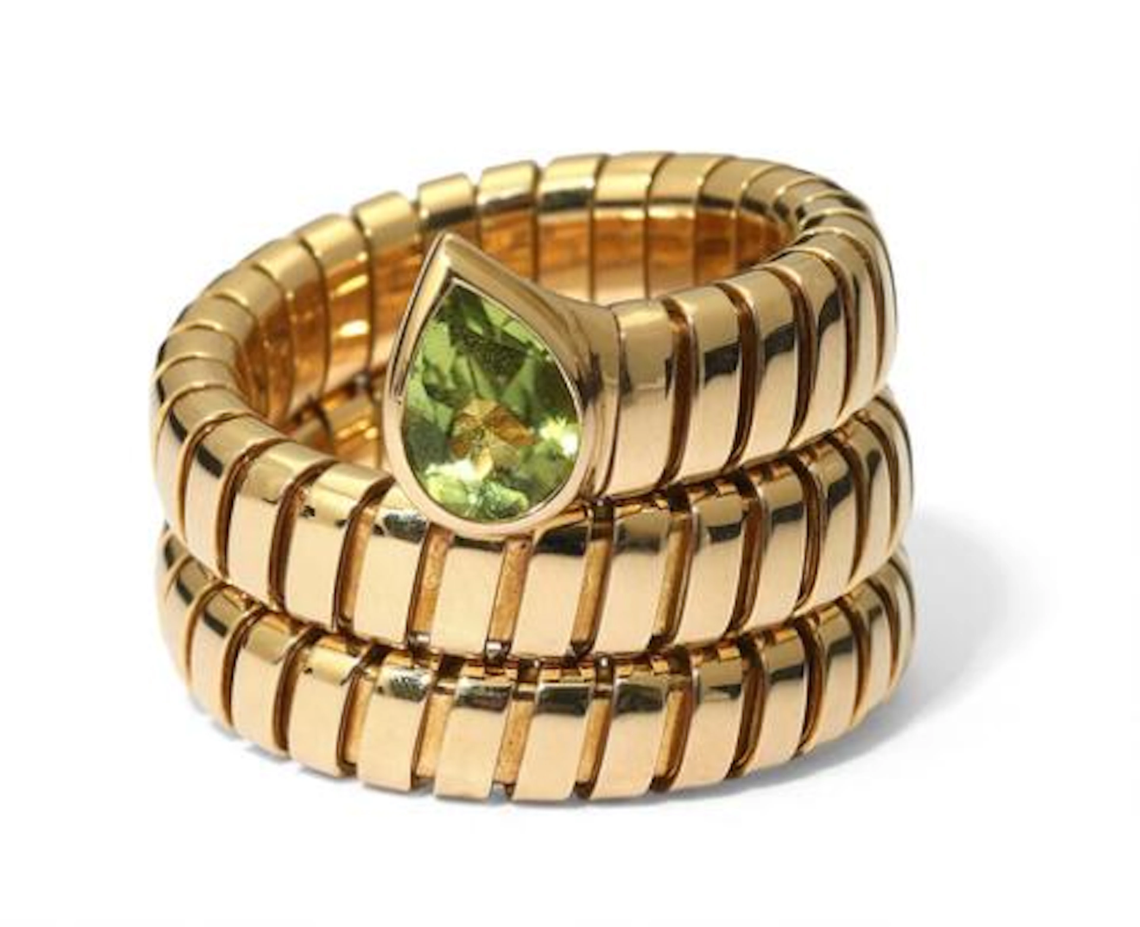 Bulgari: A "Tubogas Serpenti" peridote ring set with a pear-shaped