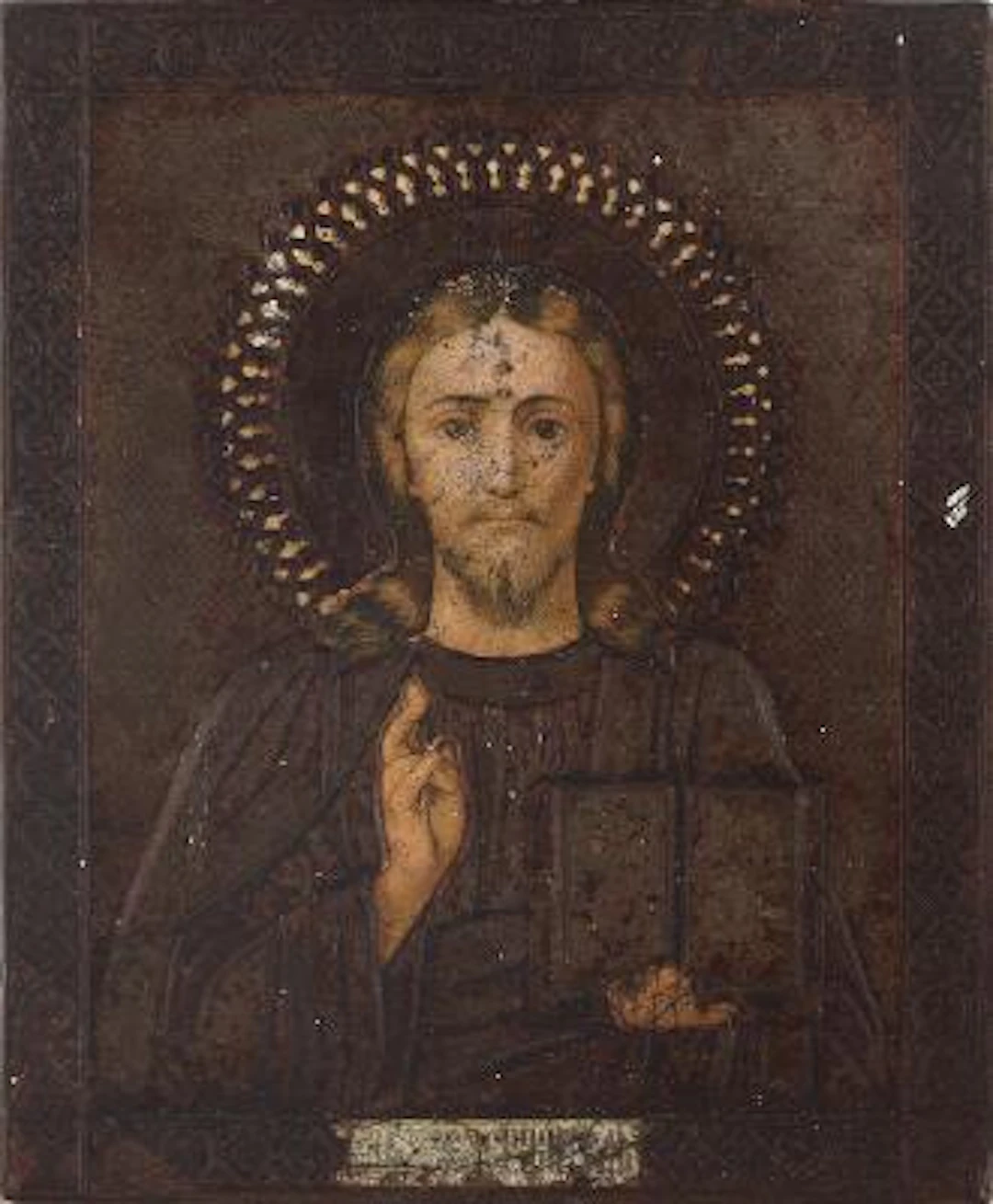 Russian icon of Christ Pantocrator. Icon with painted and chased brass