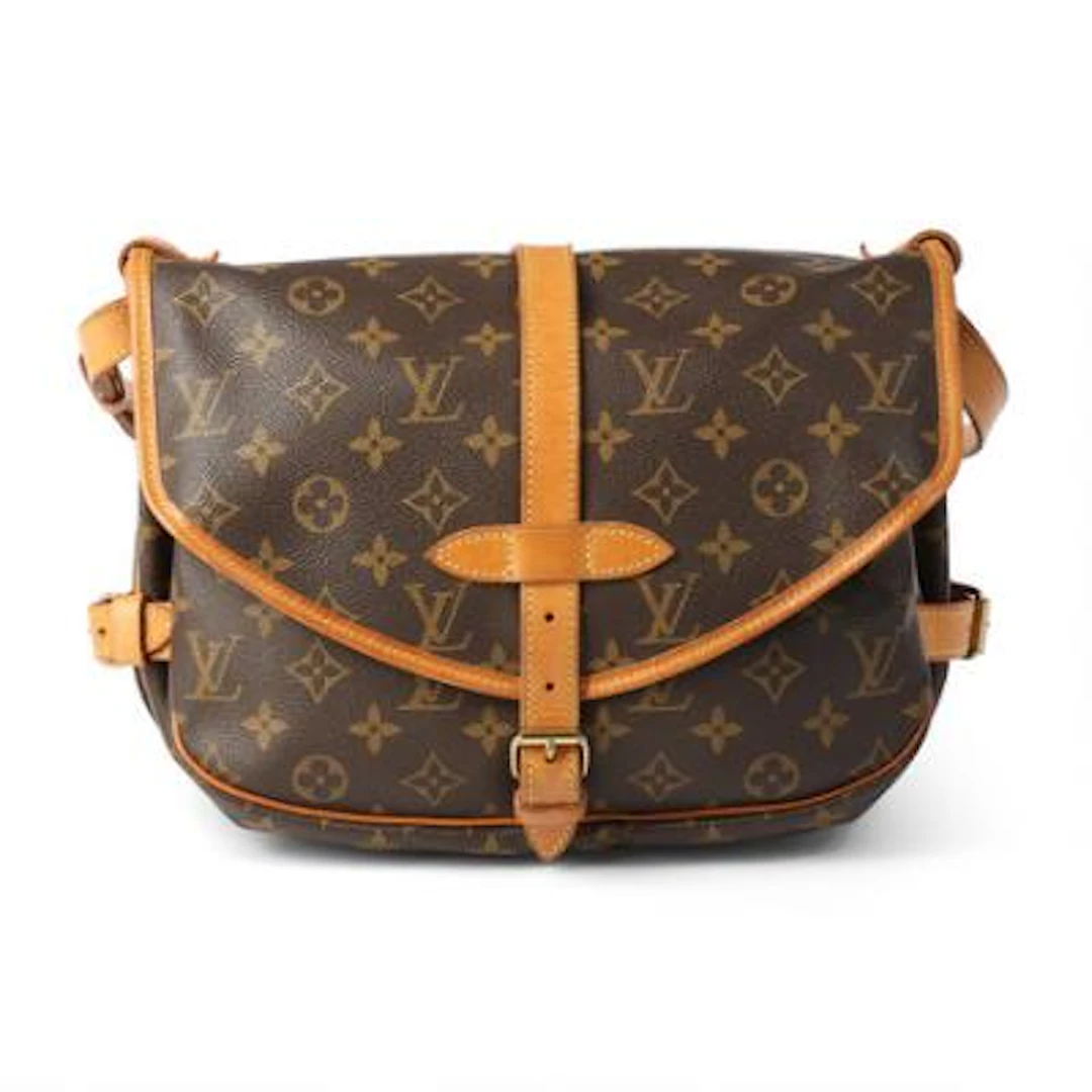Louis Vuitton: A "Saumur 30" bag of brown monogram canvas with brown