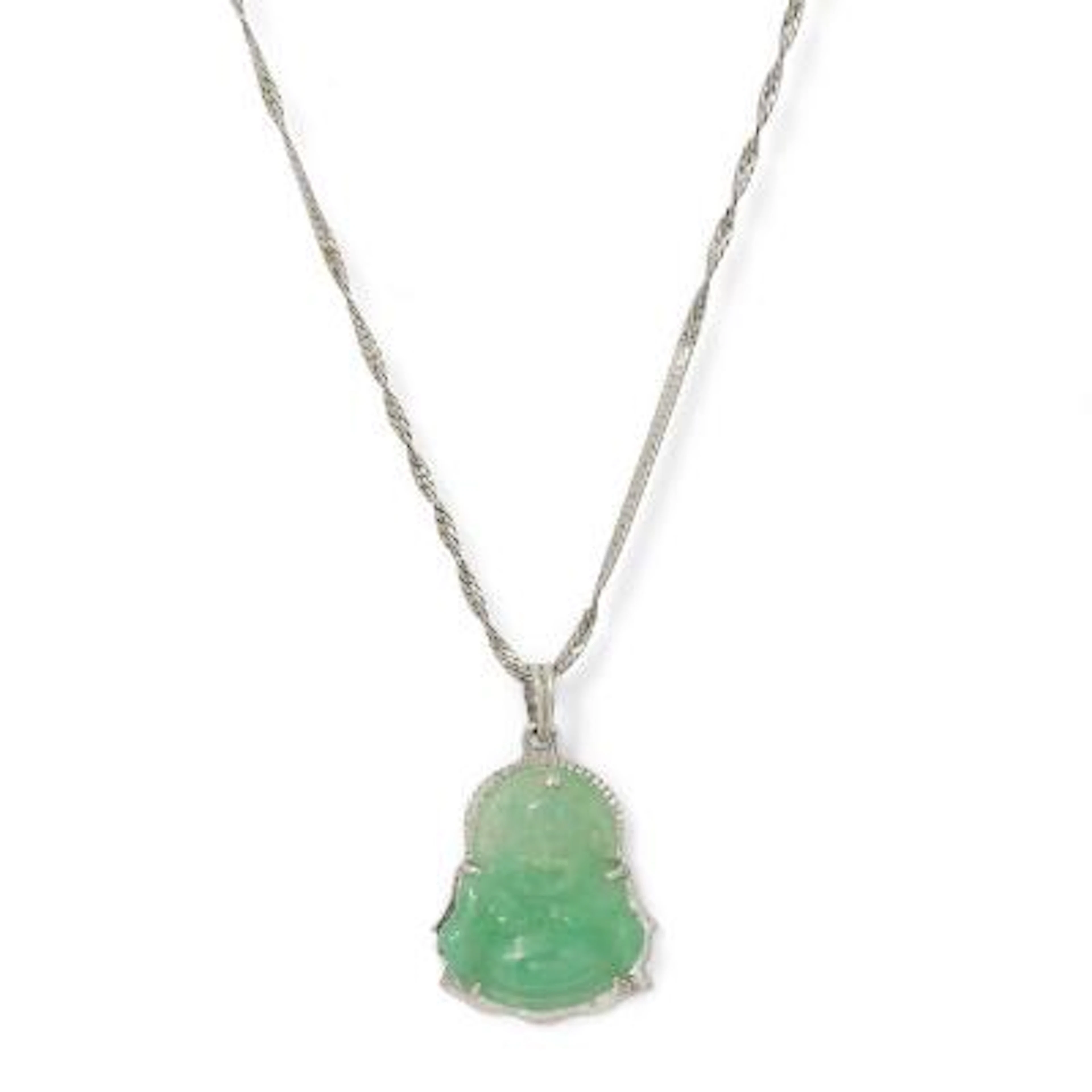 A pendant set with carved jadeite jade mounted in 18k white gold.