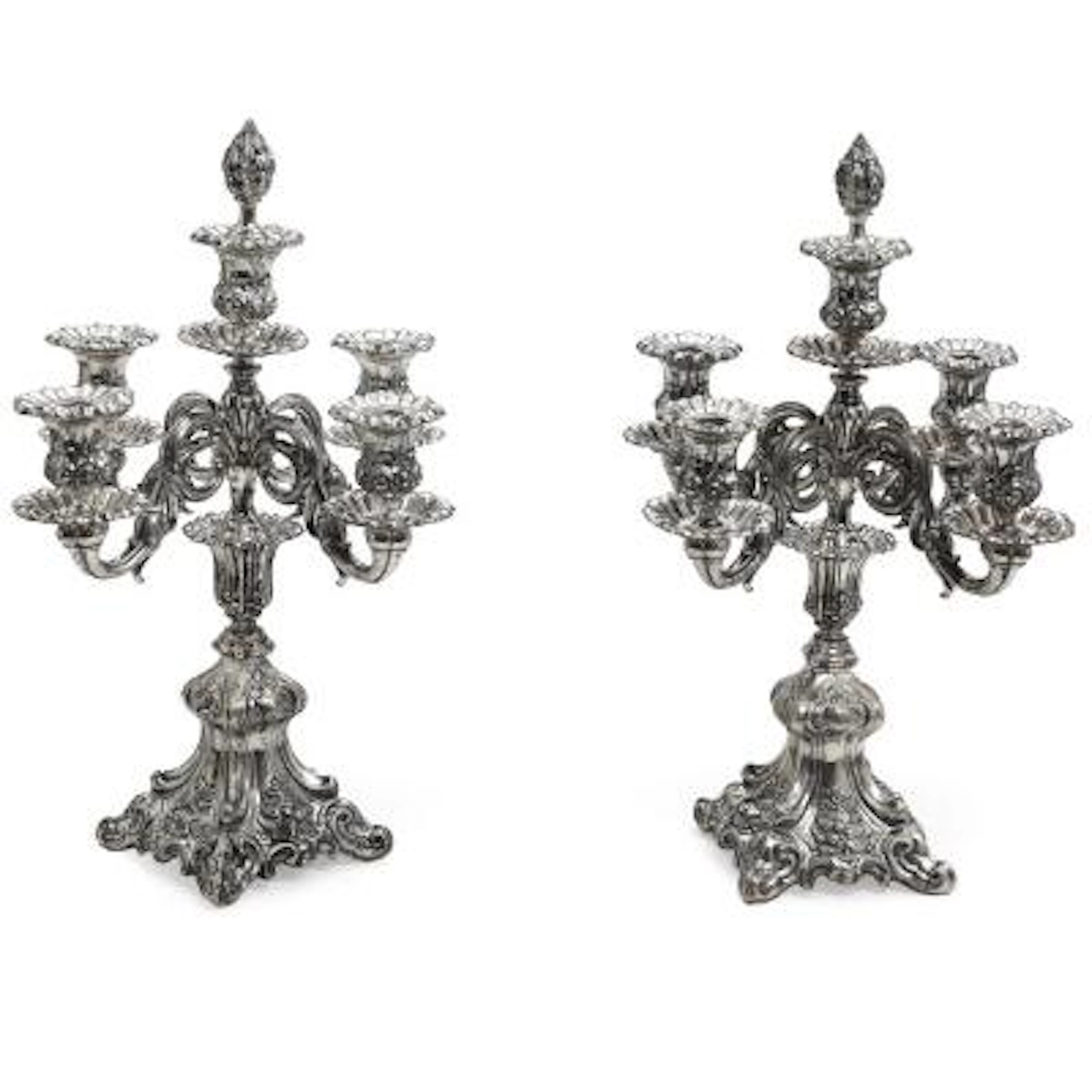 A pair of embossed silver candelabrum. Maker August Thomsen, Copenhagen
