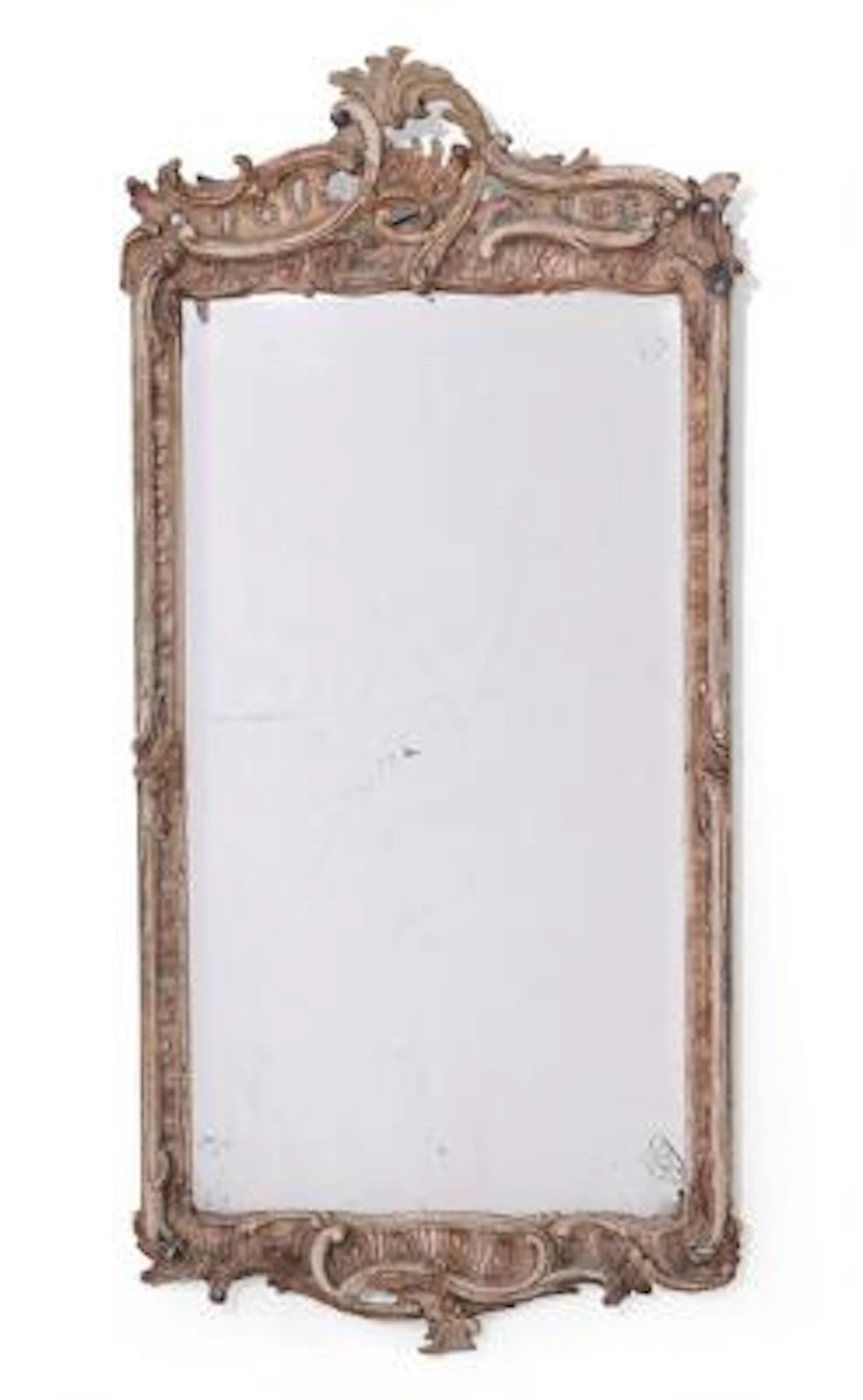 A German Rococo mirror in frame of painted wood, presumably formerly