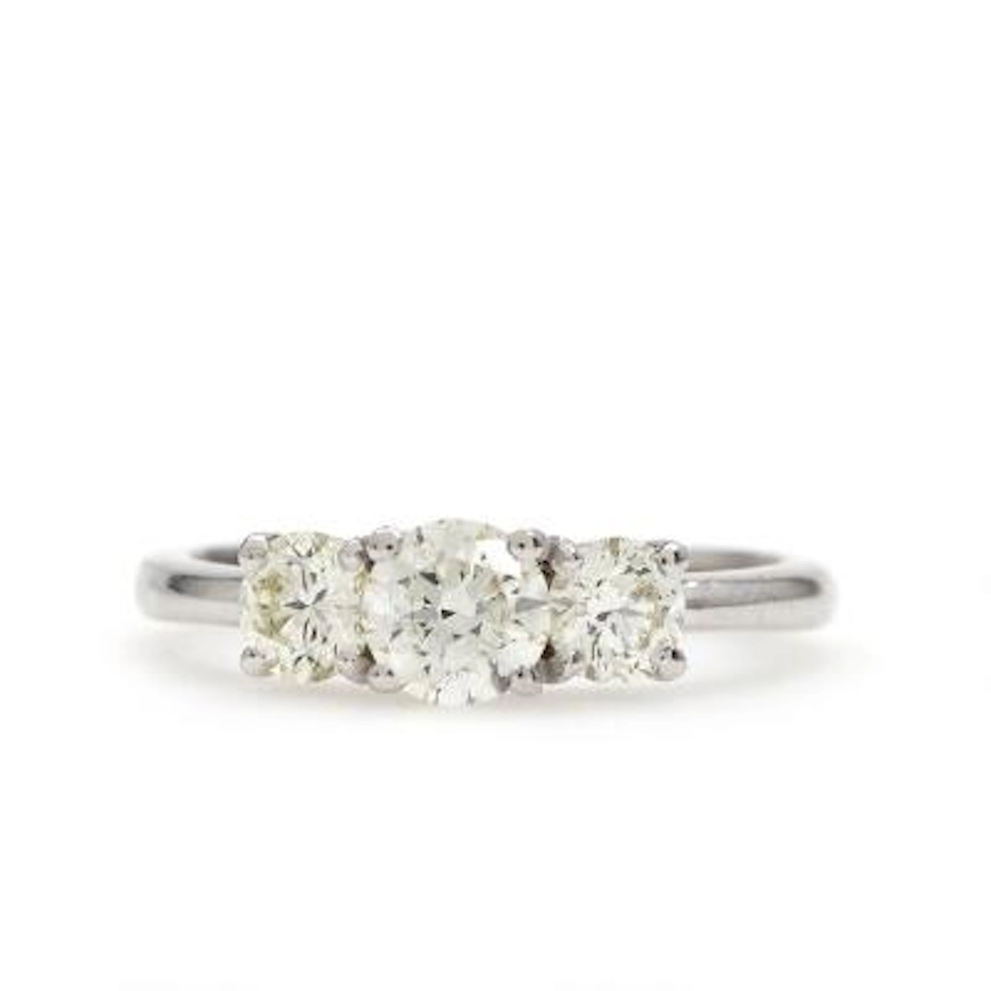 A diamond ring set with three brilliant-cut diamonds weighing a total