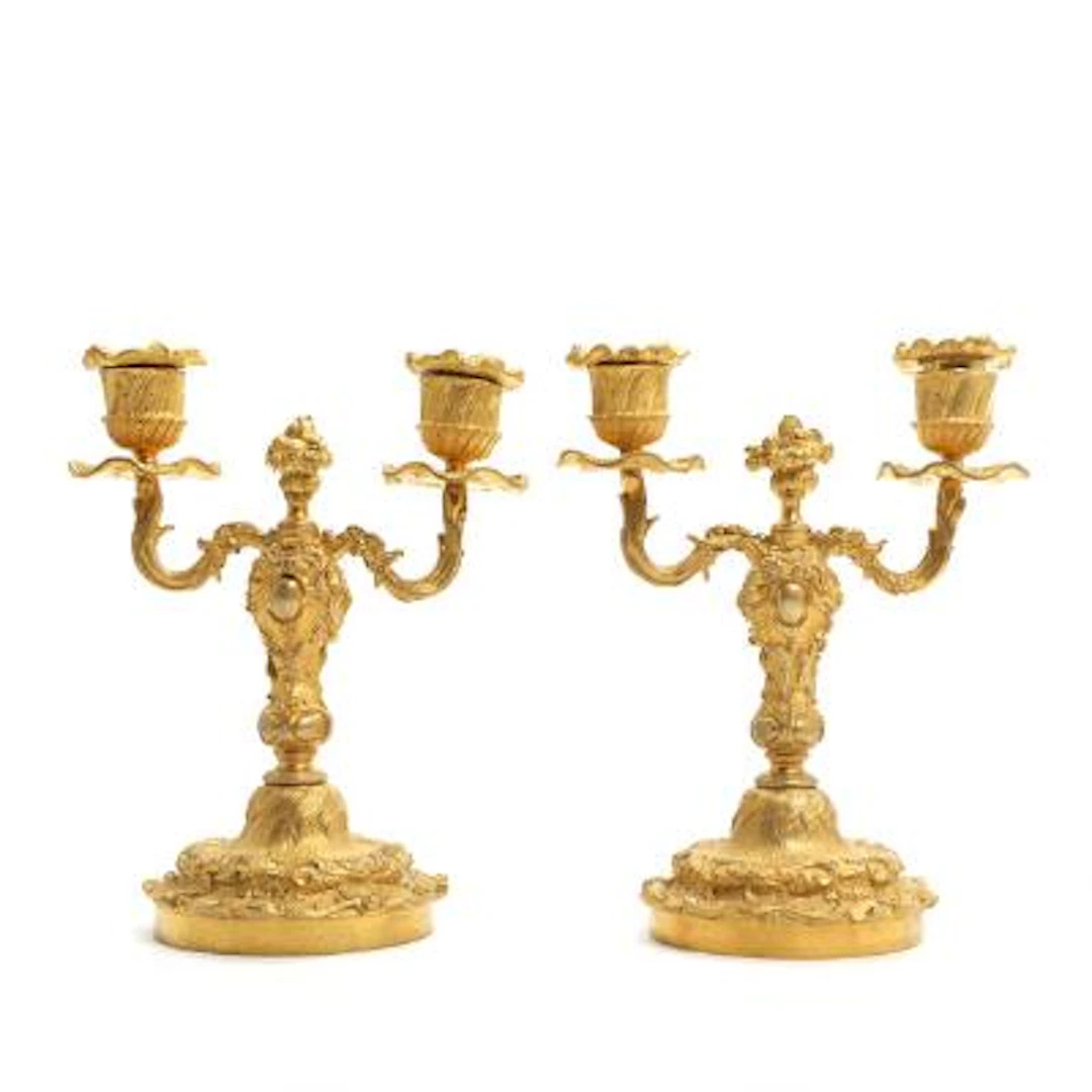 A pair of French candelabra in gilt bronze, Rococo form, 19th/20th