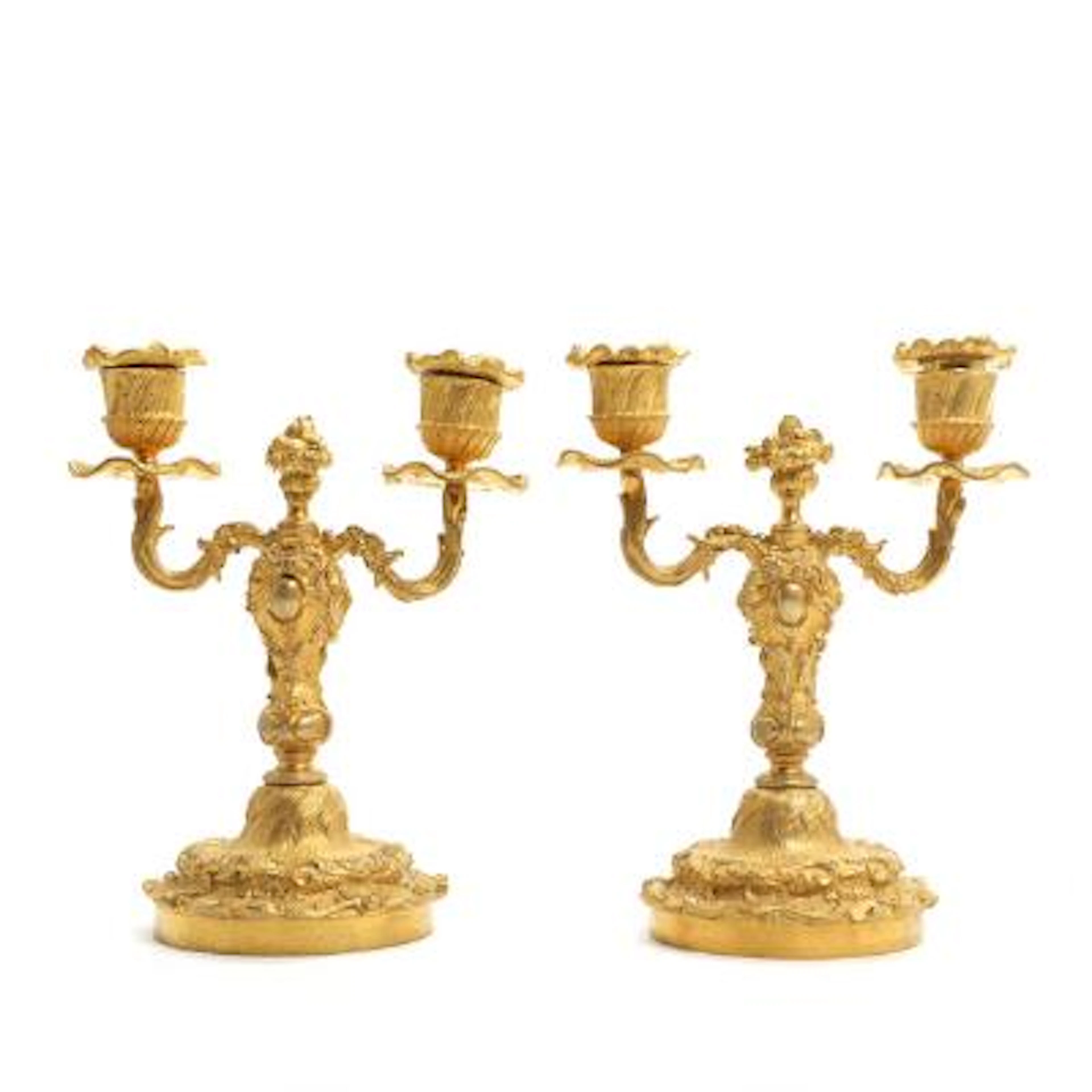 A pair of French candelabra in gilt bronze, Rococo form, 19th/20th