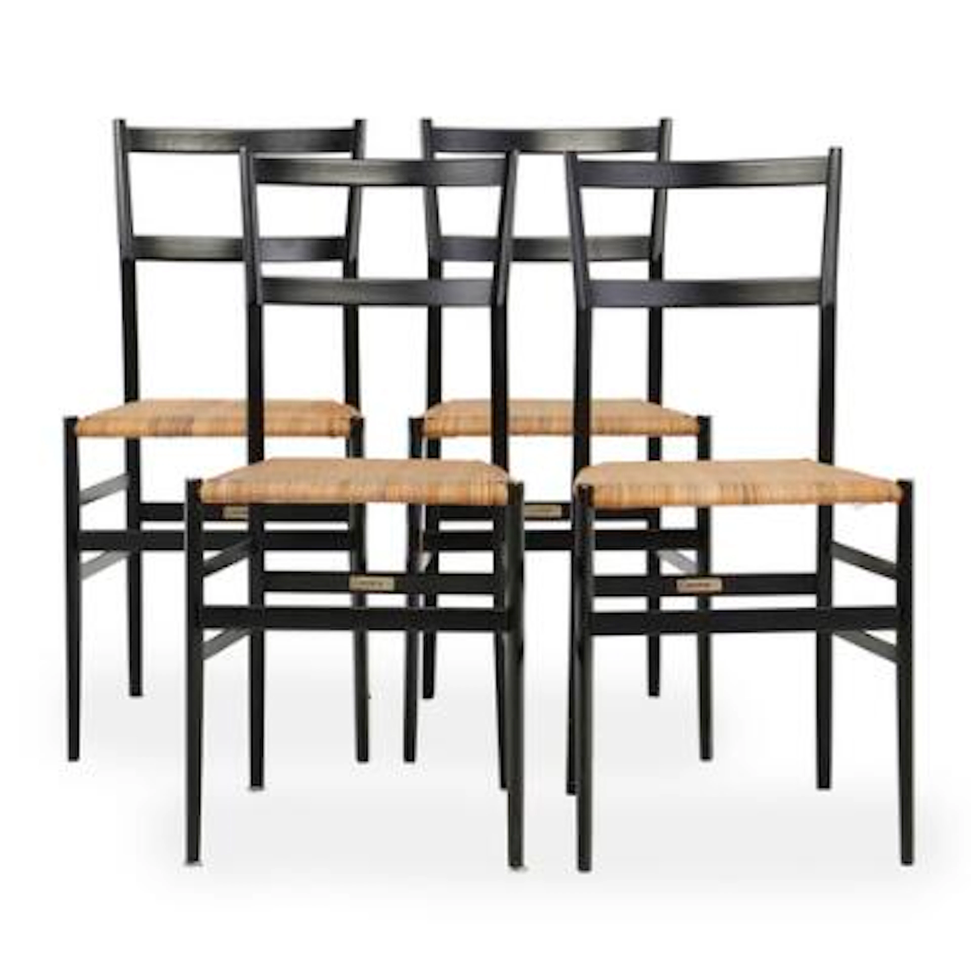 Gio Ponti: “Superleggera”. Four dining chairs with black lacquered