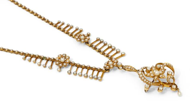 A pearl and diamond necklace of 14k gold with a detachable pendant/brooch.