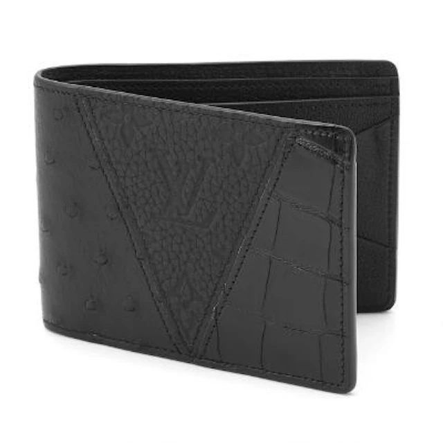 Louis Vuitton: A fold over wallet of black leather, ostrich skin and