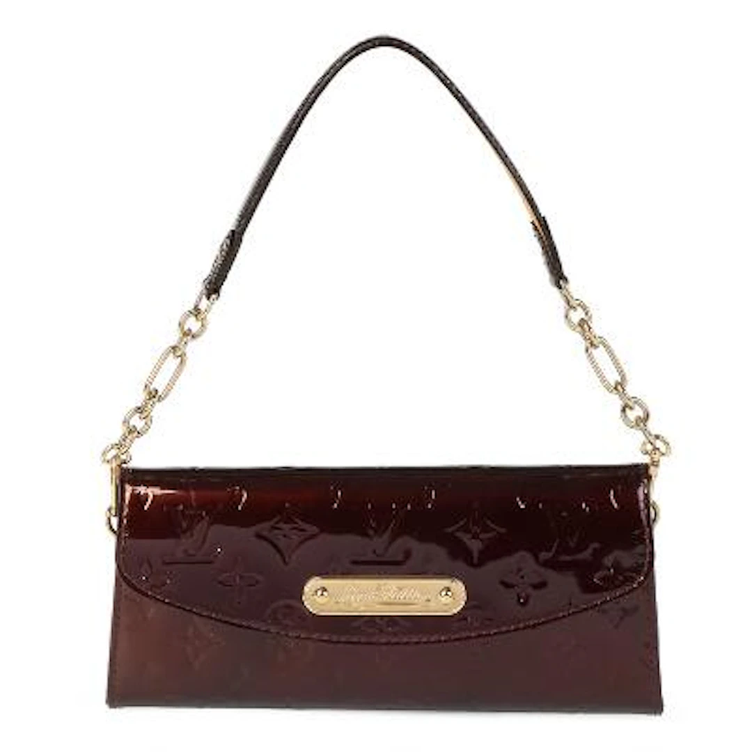 Louis Vuitton: A "Sunset Boulevard" clutch of purple monogram vernis