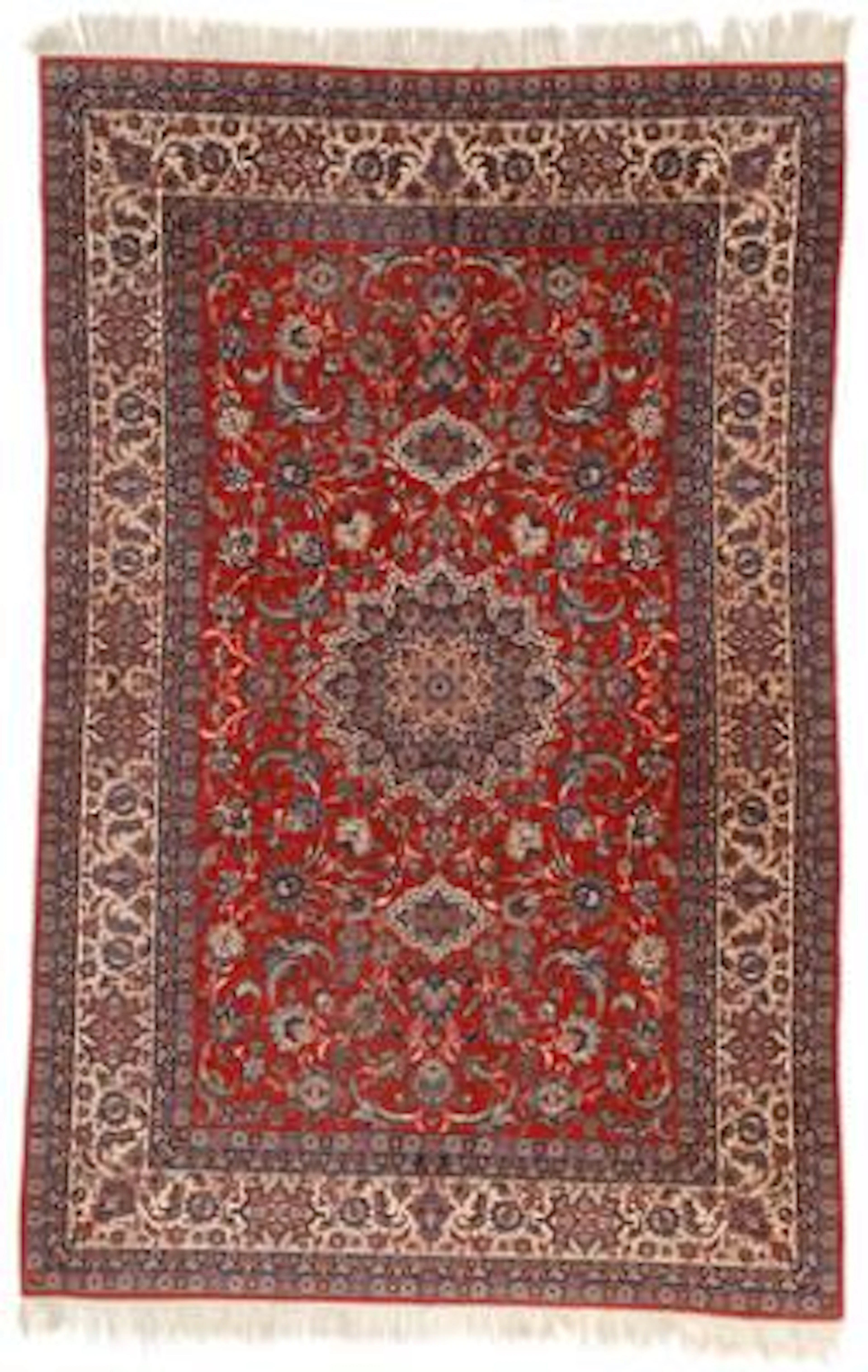 An Isfahan carpet, Persia. Medallion design on a red field with entwined