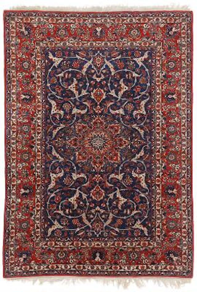 An Isfahan carpet, Persia. Medallion design on a blue field. Mid-20th